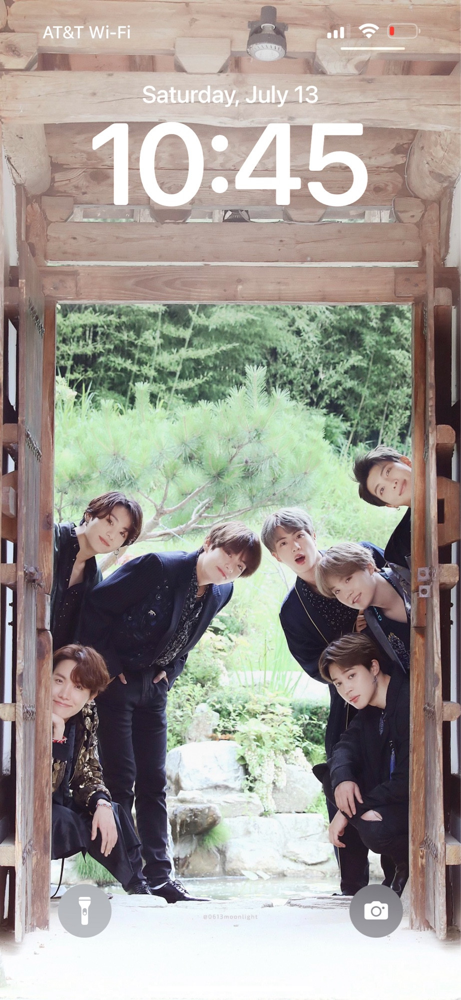 Lock screen of BTS peeking through door