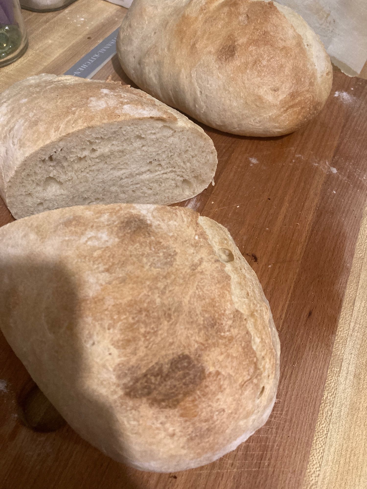 photo of two loaves of bread; one is cut open.