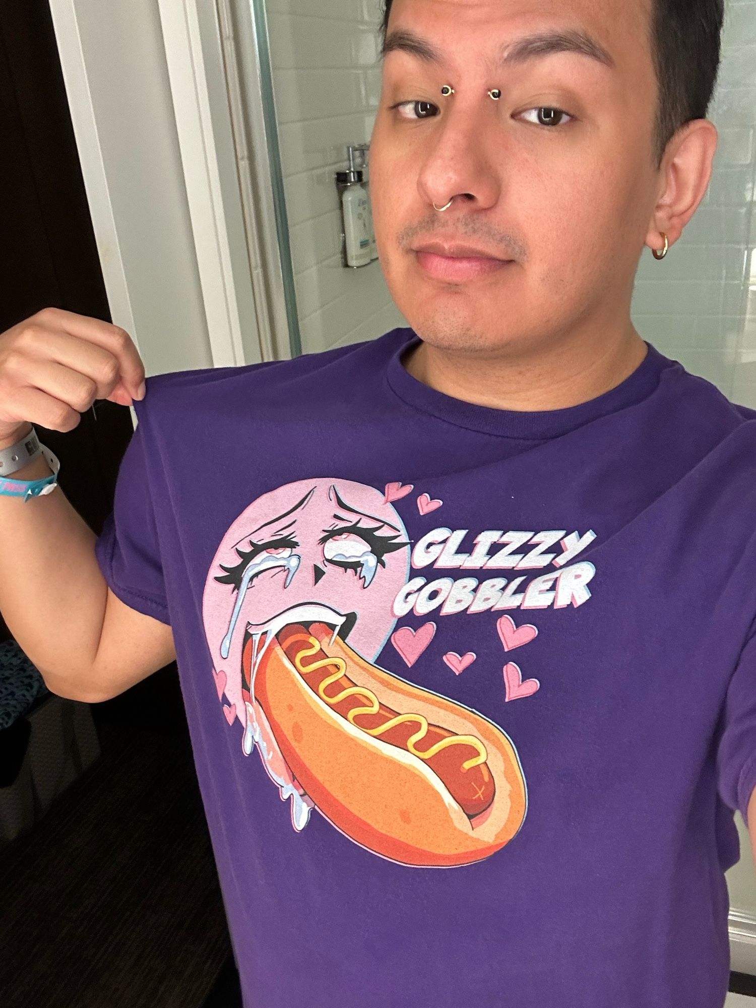 Shirt says “Glizzy Gobbler” with an ahegao face eating one