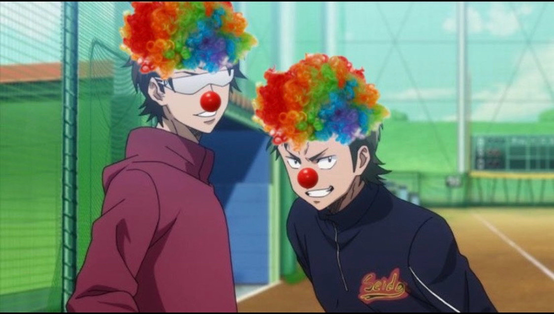 Altered screenshot of daiya no ace act ii. Kuramochi and miyuki stand next to each other grinning and have clown noses and rainbow wigs added to their heads. 