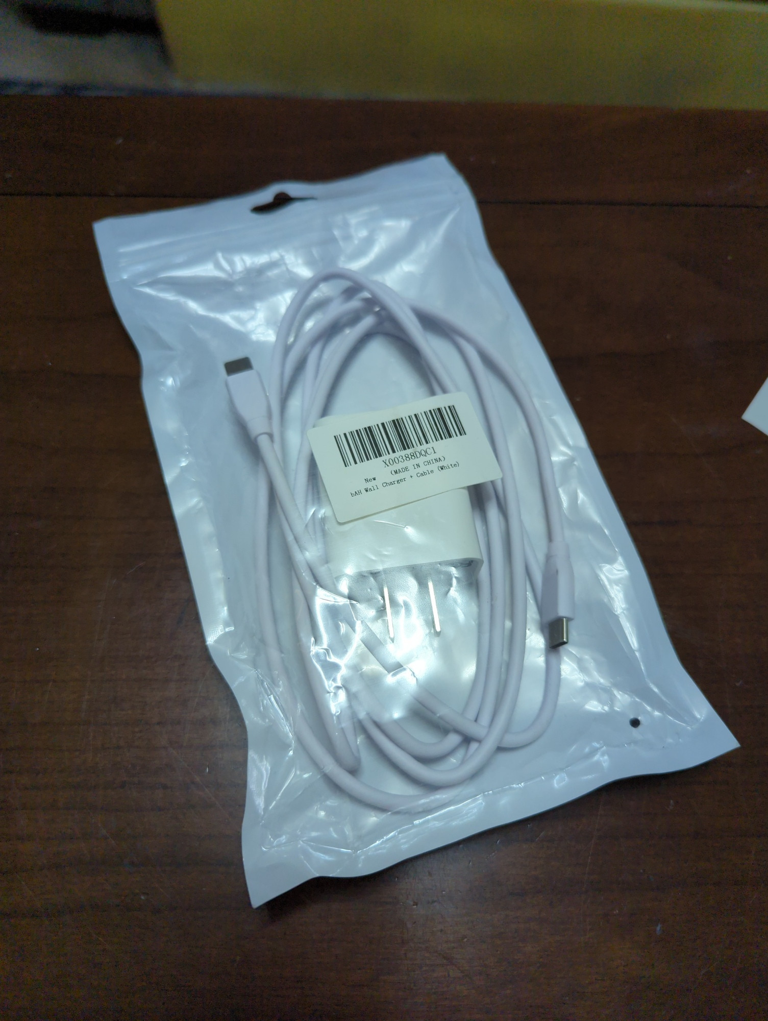 A phone charger in a Ziploc bag
