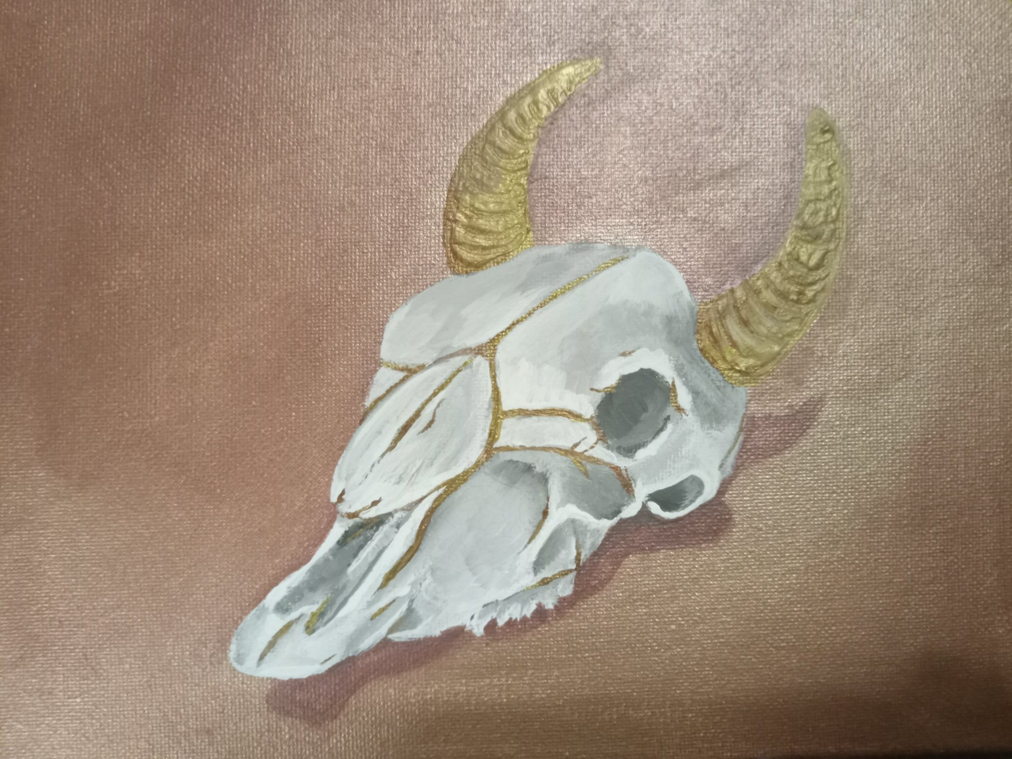 painting by me (theeshadylady) of a cow skelton with gold horns and skull cracking on a rose gold background - media: cheap acrylic paint