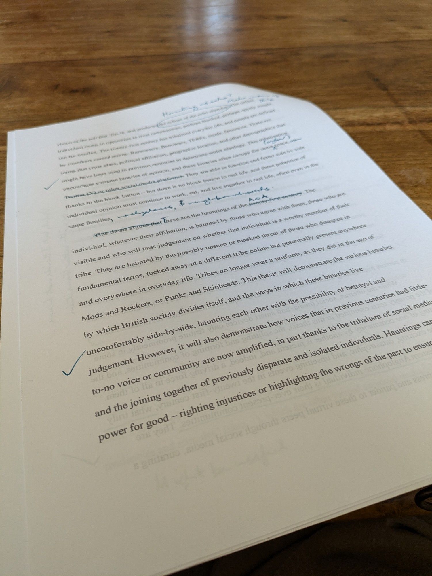 A page of typed text with handwritten annotations in blue ink