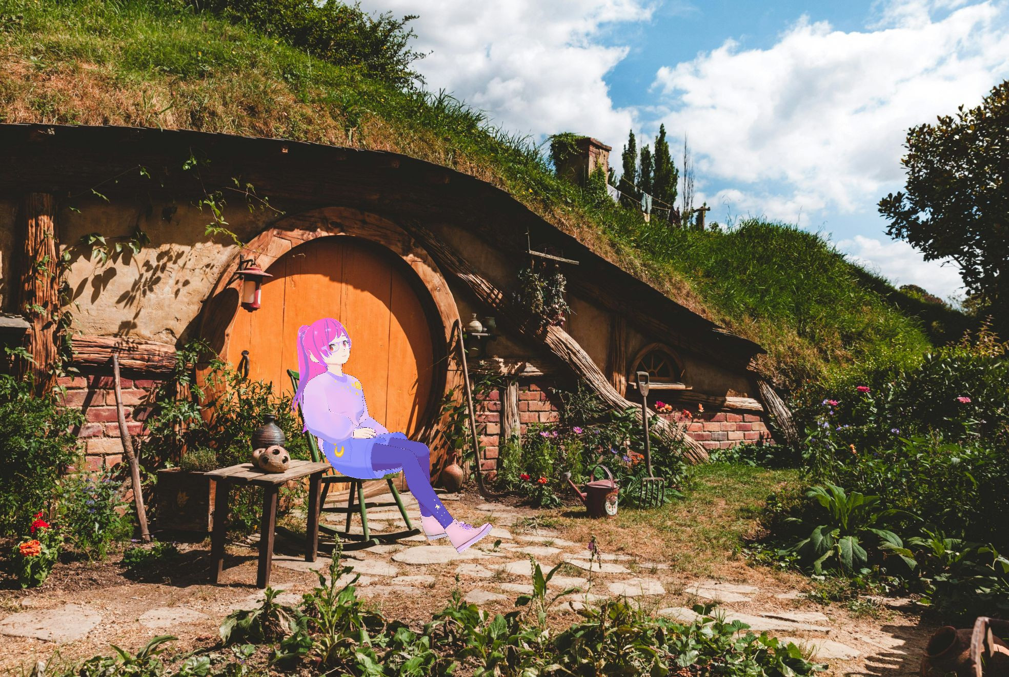 Monday Moon hanging out on a chair in front of a hobbit home. Monday Moon's a white woman vtuber with pink hair and a shades of purple sweater, shorts, and tights, relaxing on a chair in front of an earth sheltered hobbit home with a cheery round orange door. It just looks sunny and comfy!