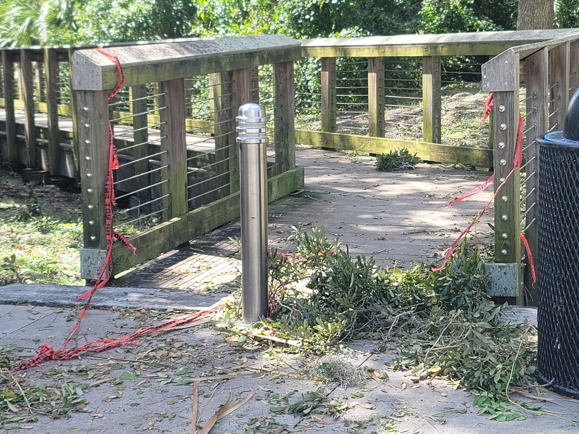 A boardwalk with ripped caution tape