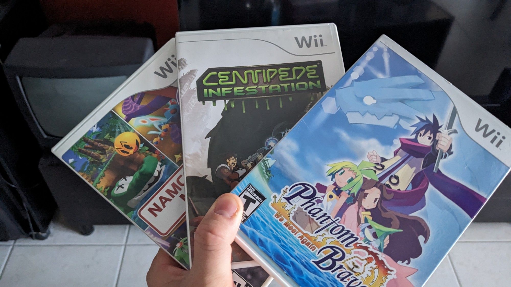 Namco Megamix, centipede infestation, and phantom brave games, for Wii.