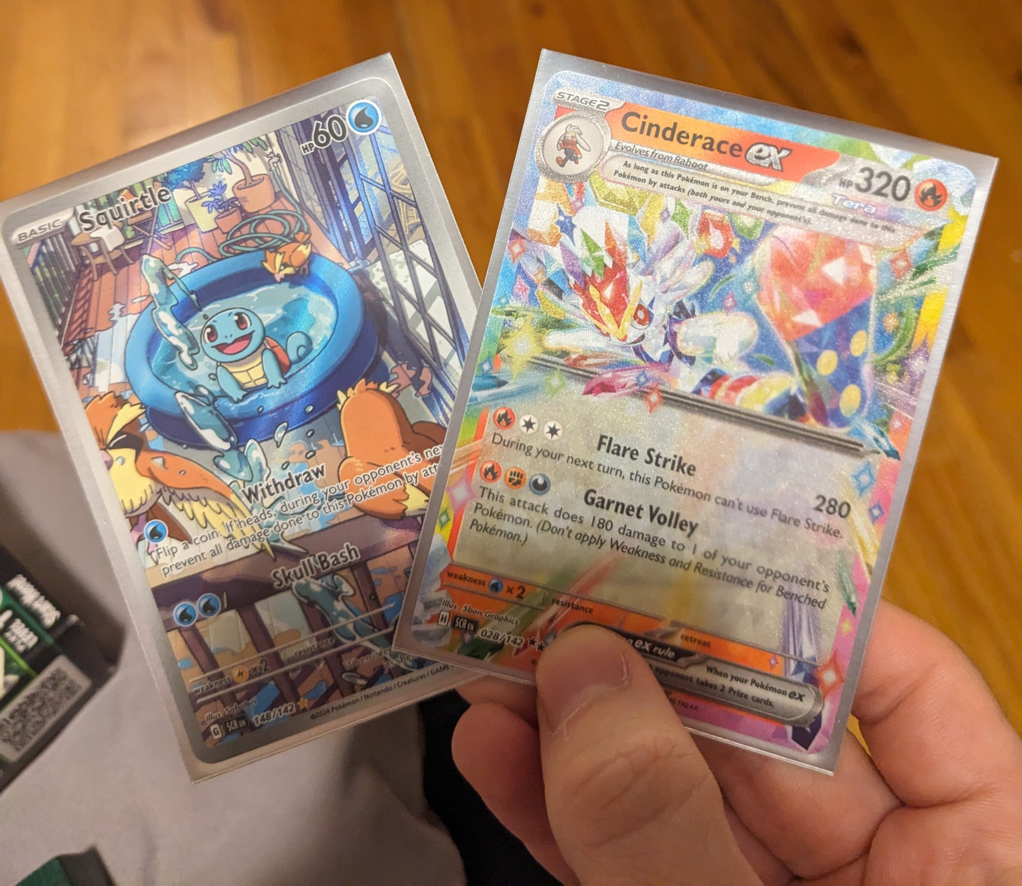 A secret full art Squirtle card and a TERA Cinderace EX