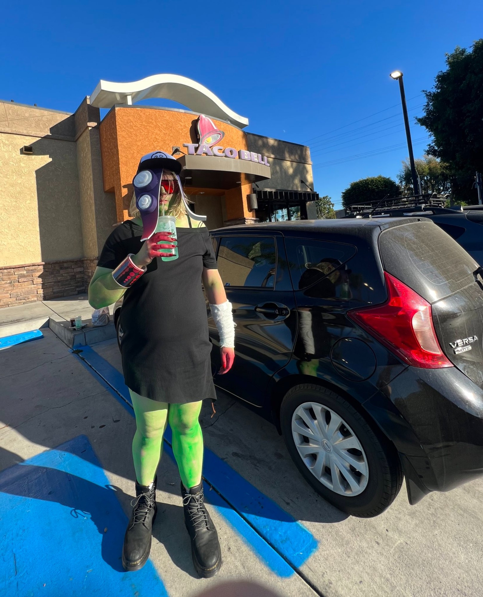 me in acht/dedf1sh cosplay sipping a baja blast in front of taco bell at socallie october 2023