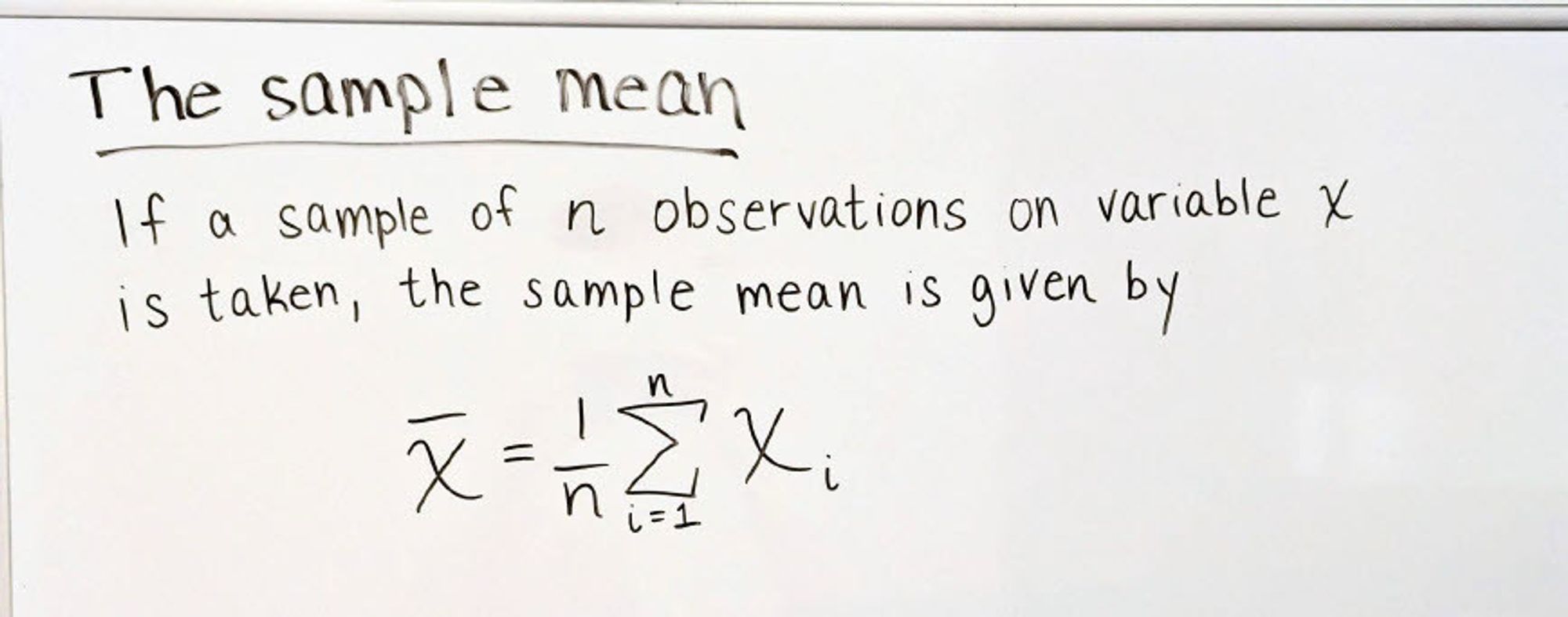 Image with handwriting explaining the sample mean, including the equation