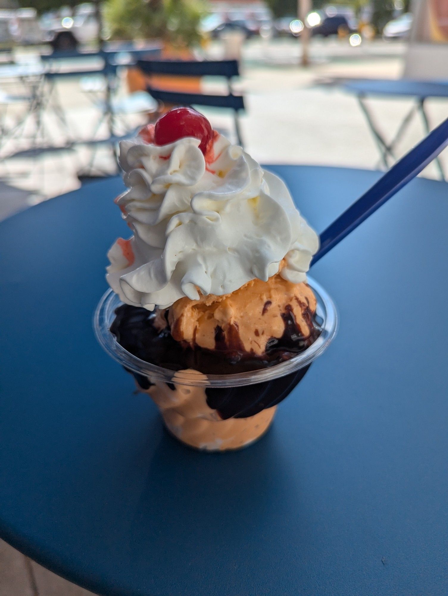 Pumpkin Ripple ice cream with hot fudge, whipped cream, and a cherry on top.