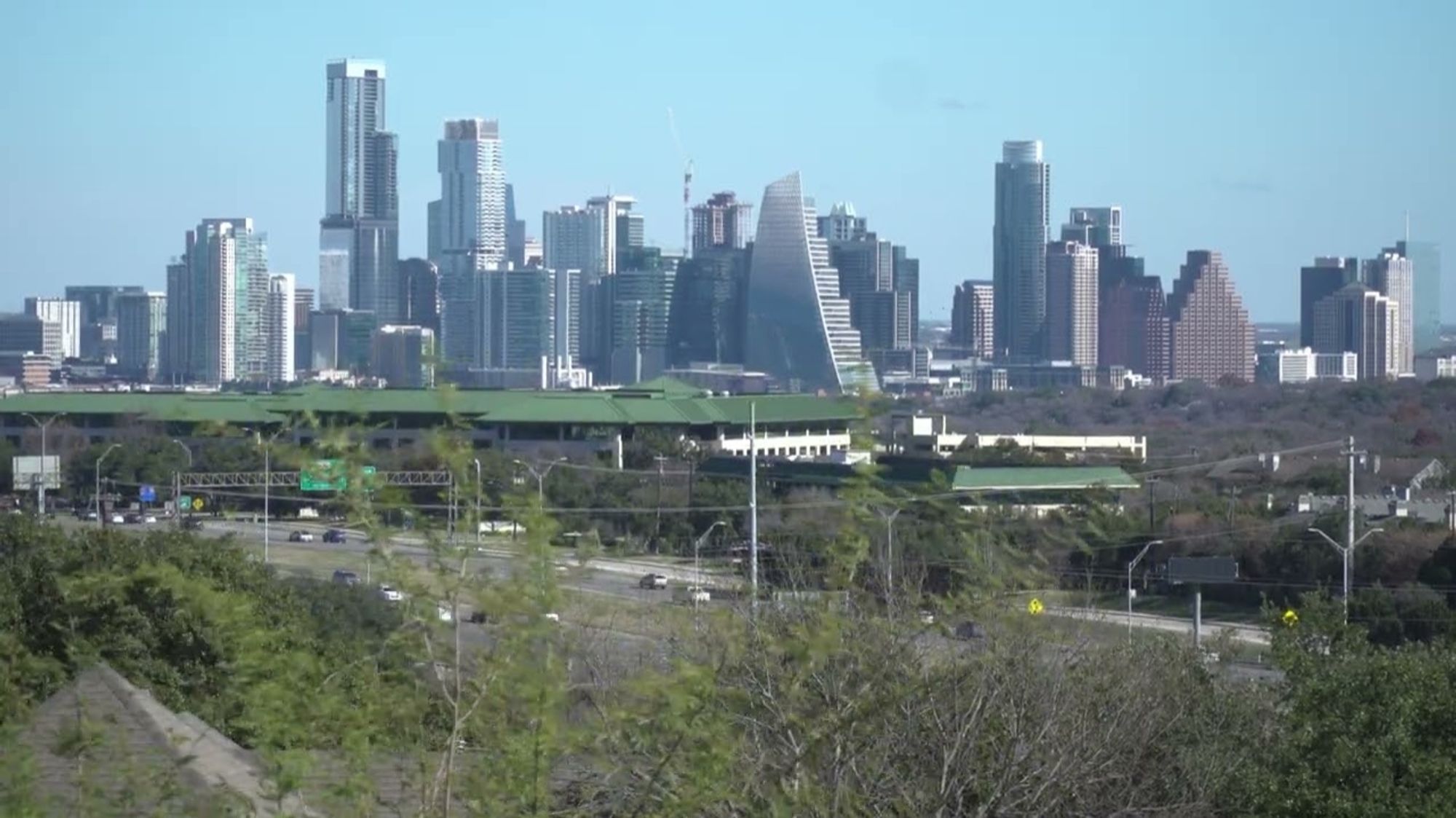 A photograph of the Austin skyline. It consistents mostly of modern glass facade skyscrapers