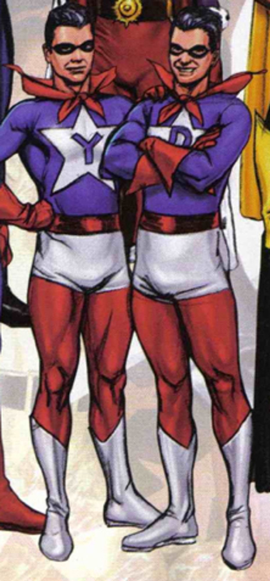 identical generic Caucasian male teenagers in skintight outfits with blue shirts, red gloves and red … little collar cape things??? they’re just the collars. anyway they got white boots and white underpants and they wear little black or red domino masks and red belts. they’ve got giant white stars on their chests. the one on the left has a blue letter Y in the star and the one on the right has a big uh. a big D