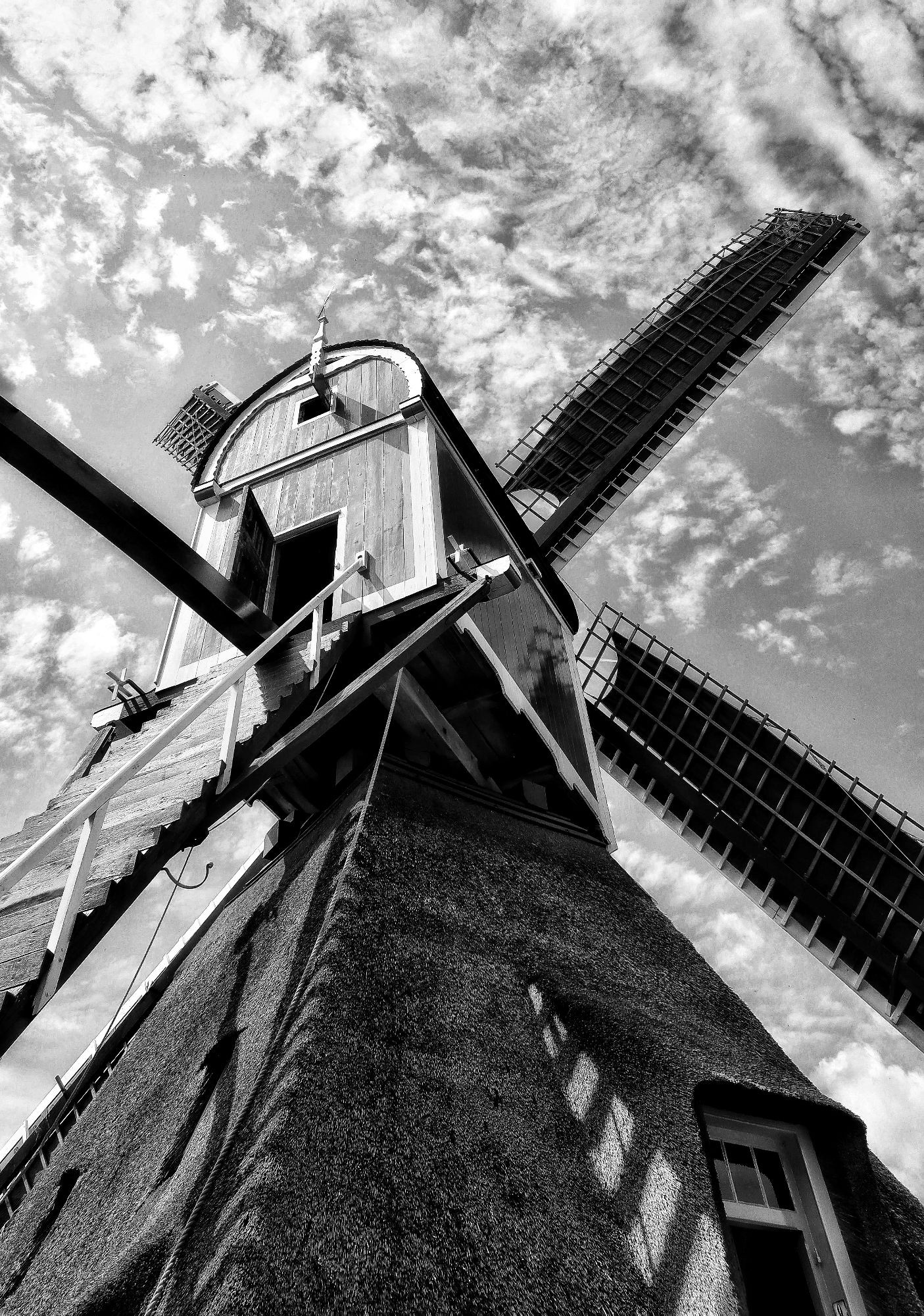 Windmill pic taken close by  and looking up. Stairs leading to the top. B&W