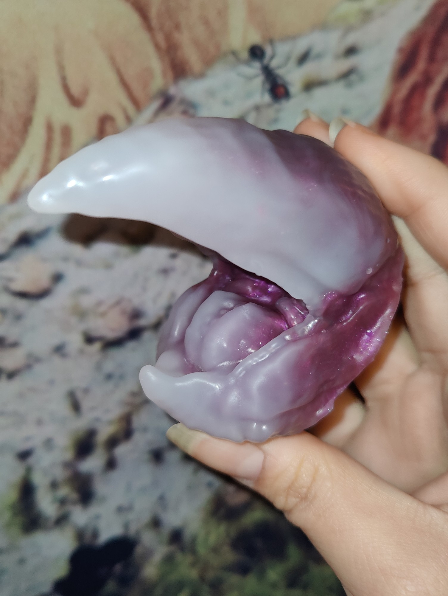 A beak inspired by a squid? This beak is white (or clear) with a purple base. It's made by A Krows Nest.