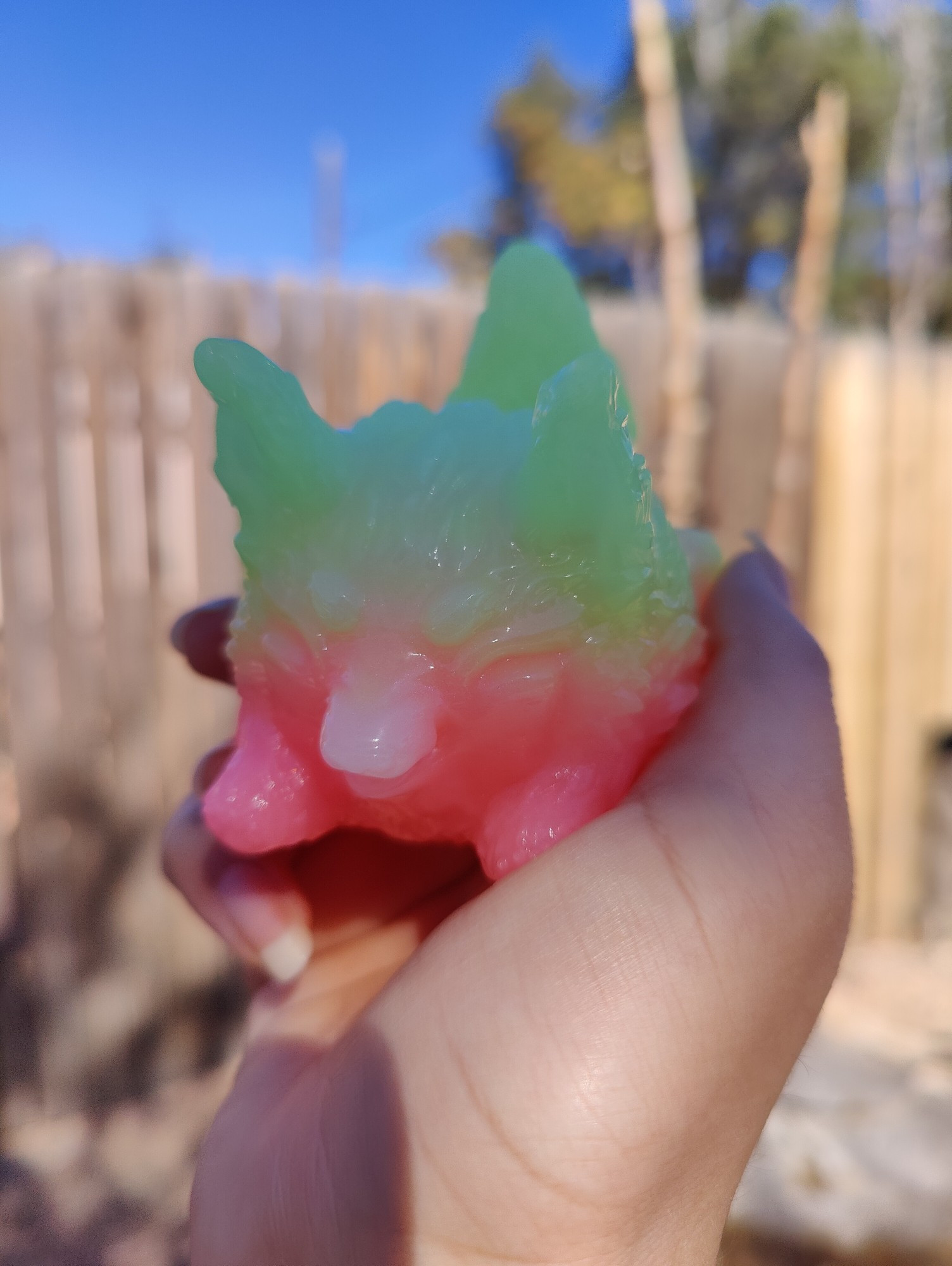 A werekit (a werewolf?) from Hodge Podge Entourage. This kit is green and gummy orangish pink. 