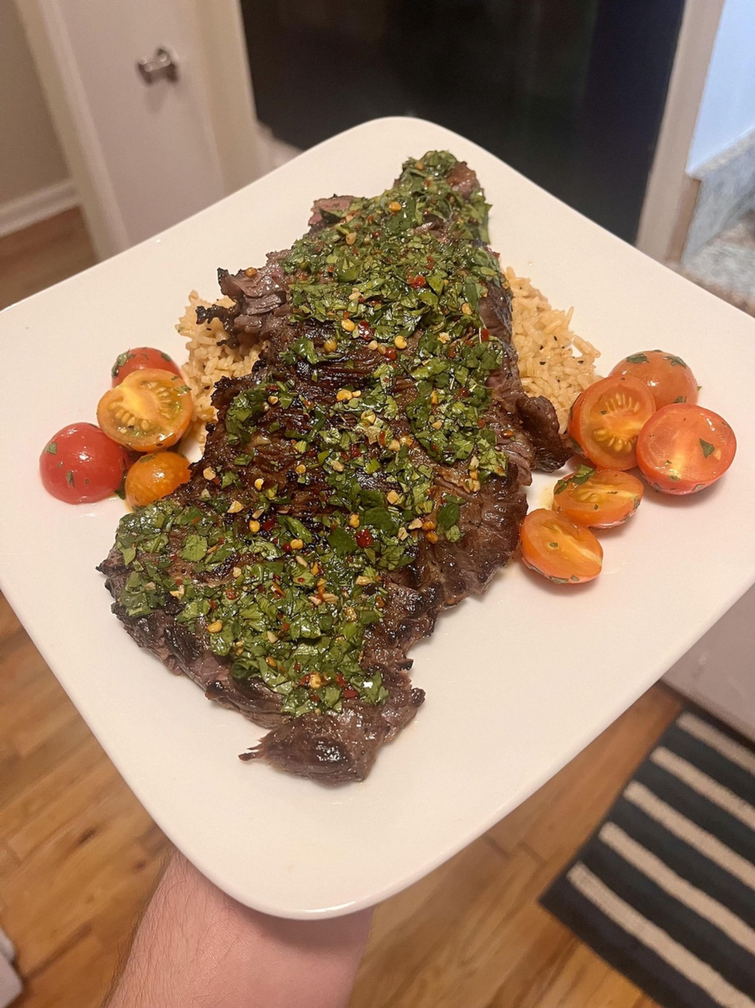 Image from Reddit post titled '[homemade] Chimichurri Skirt Steak w/ Chili Rice and Tossed Garden Tomatoes' by IAmEatery.