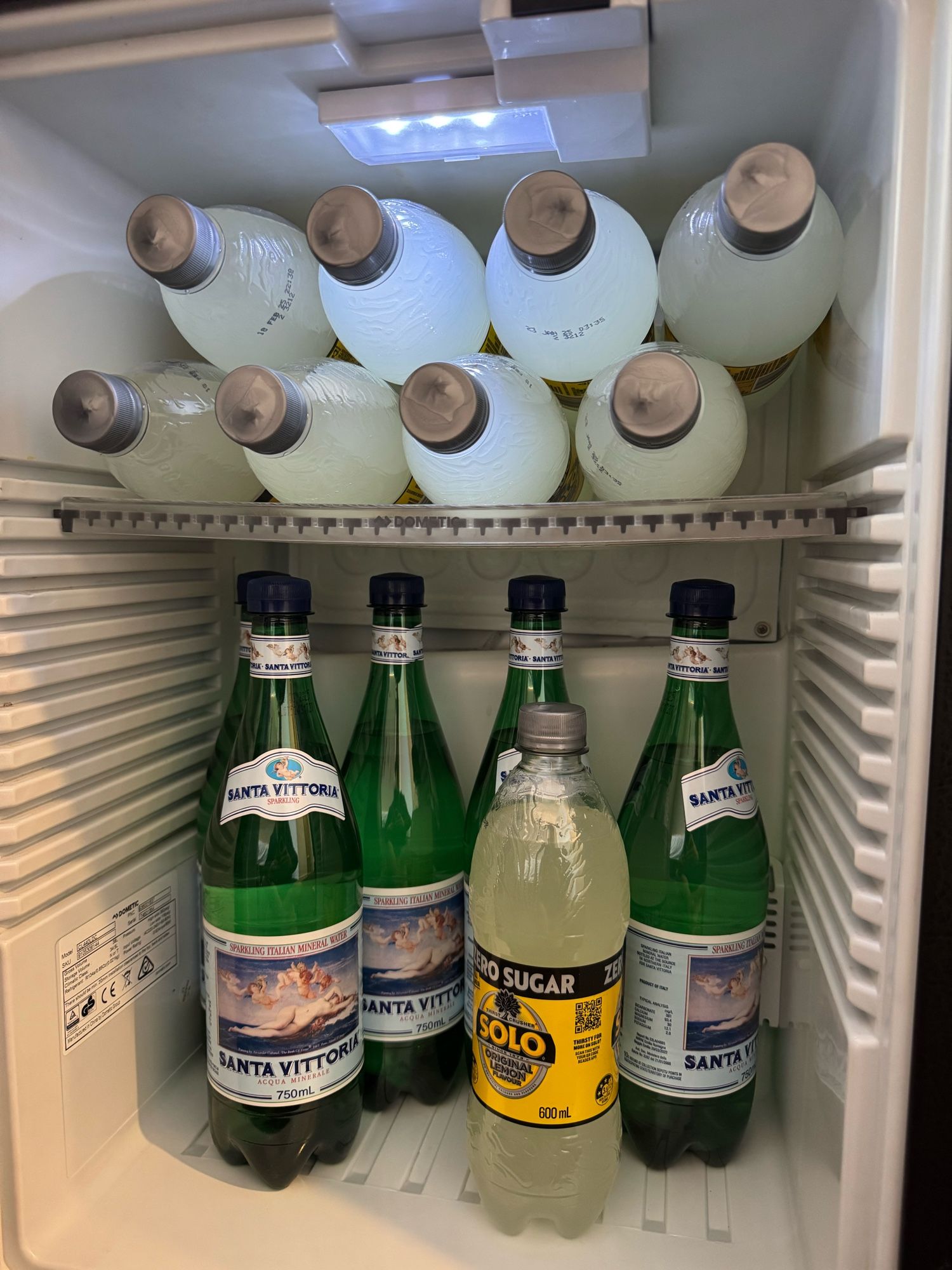 A fridge full of solo and sparkling water