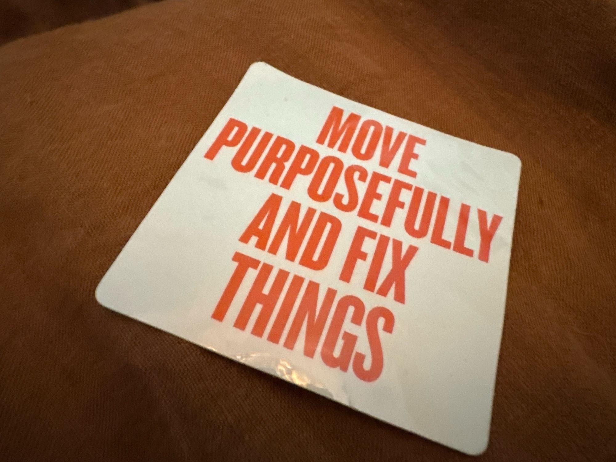 Sticker that says “Move Purposefully And Fix Things”