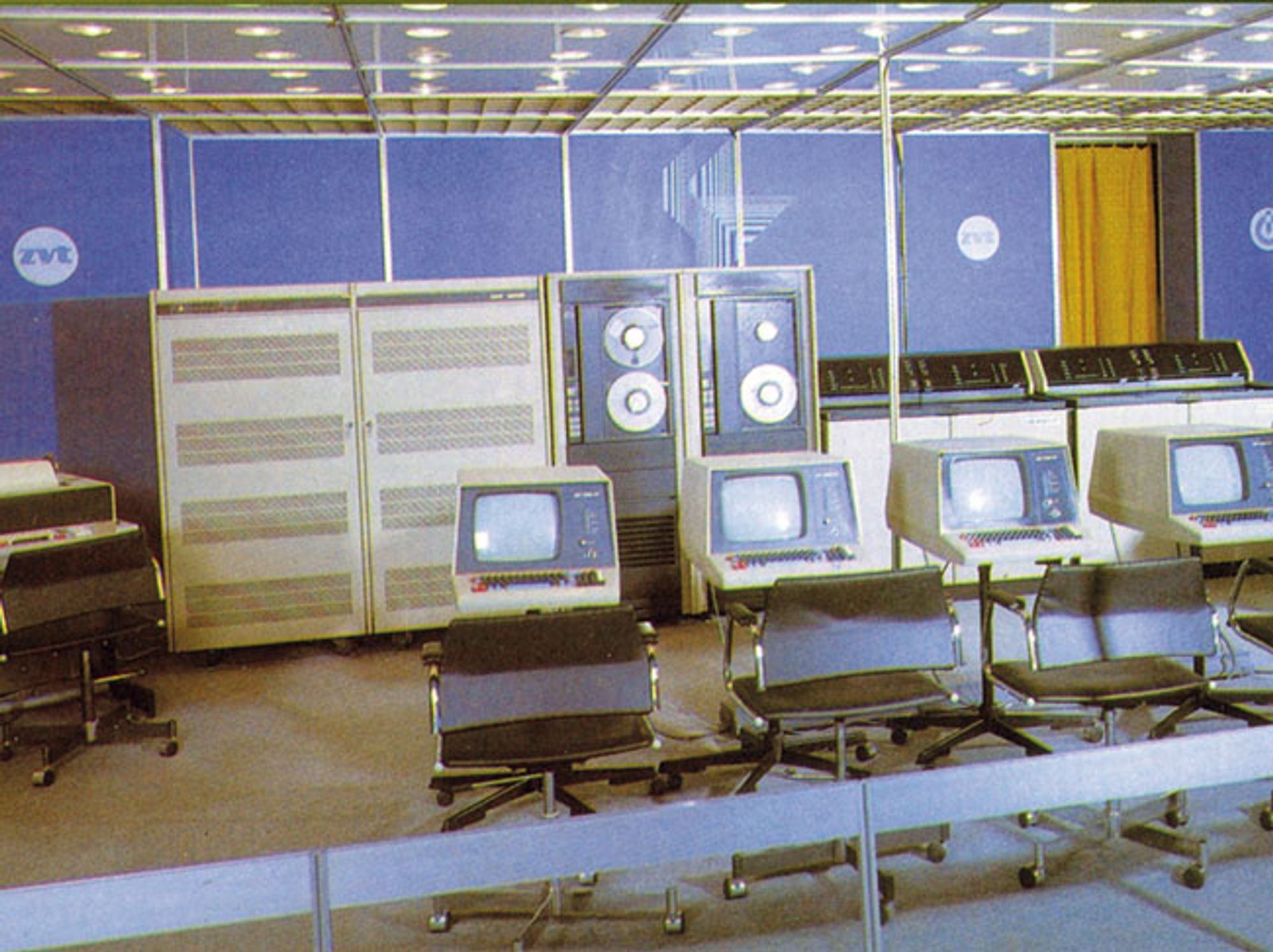 A 1980s color photo of the Czechoslovak computer system SMEP, containing free standing units and terminals.