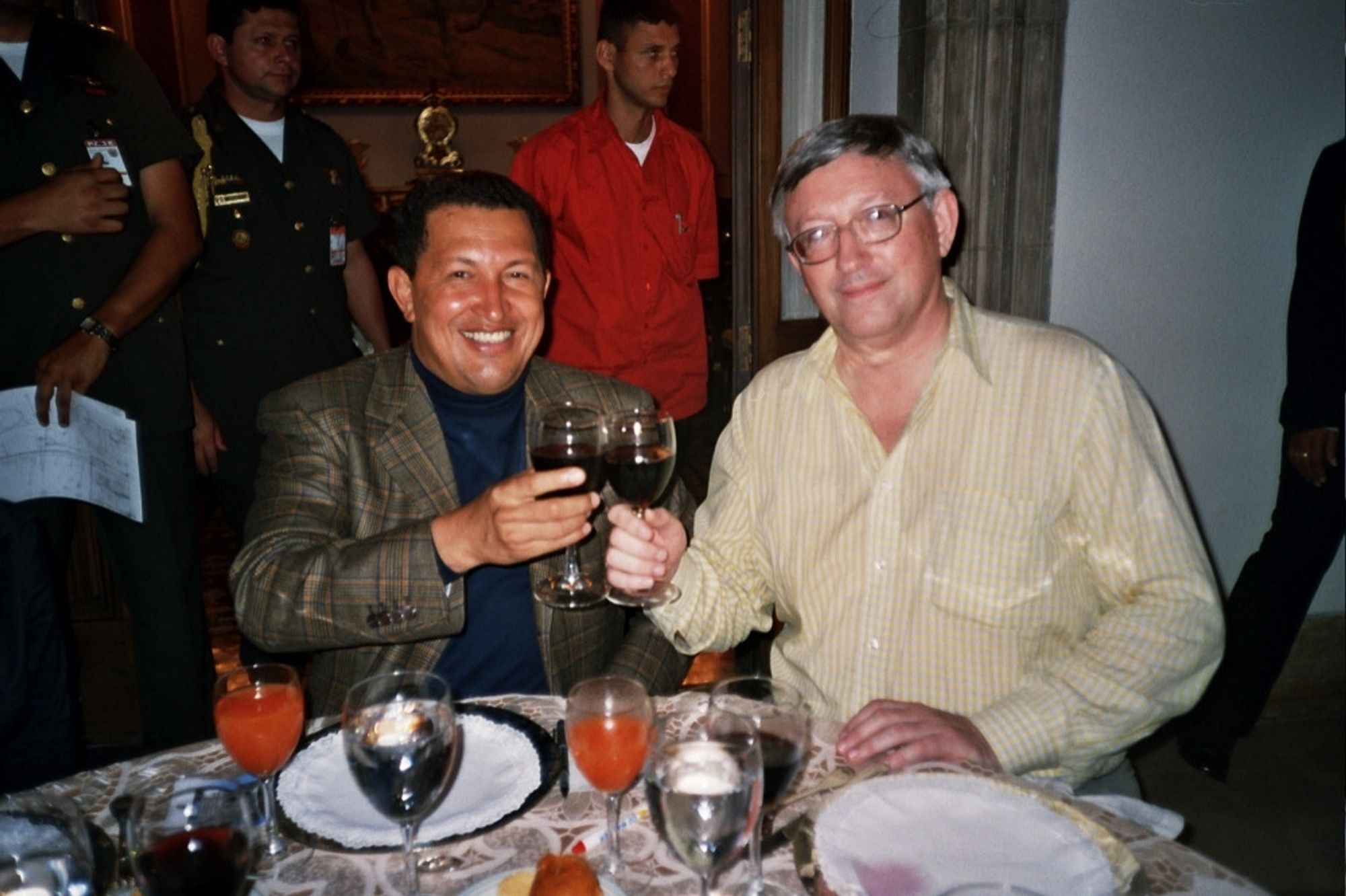 Hugo chavez and Alan woods drinking wine together