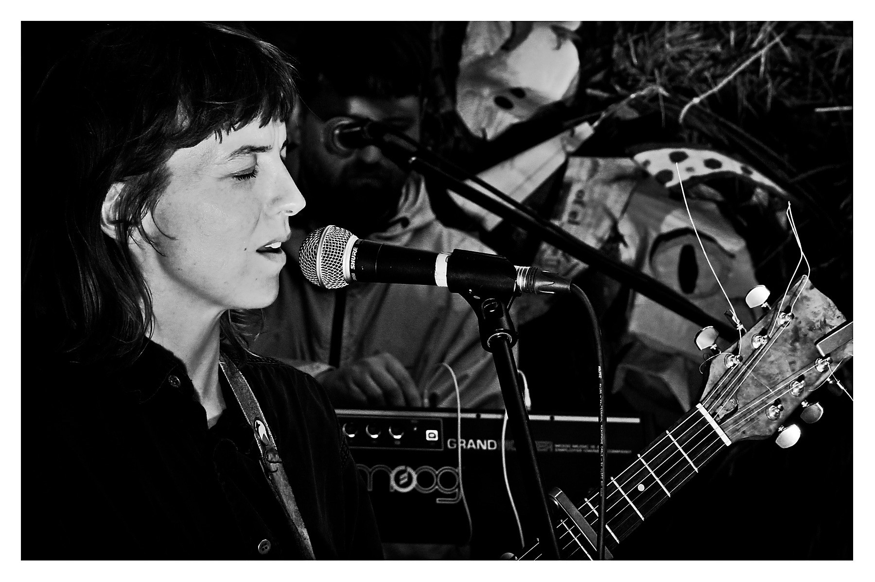 Side on close up of Rozi Plain at the mic at Levis Corner House, Ballydehob.