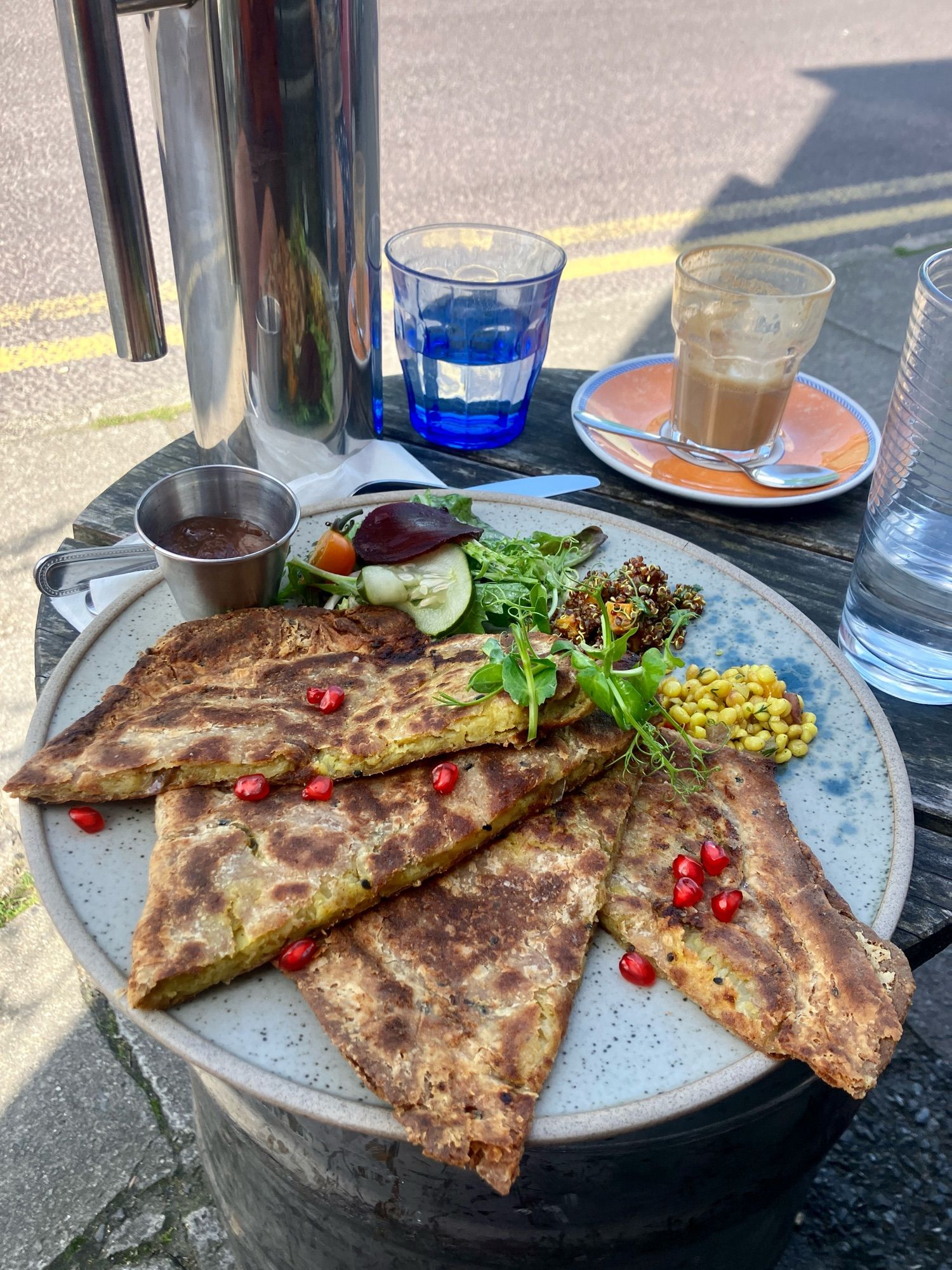 Stuffed Paratha with salad and chutney. The paratha was a bit ‘baked’ dry on the edges. Not sure what happened there. Tasty all the same. 

Also in the picture, a half drunk coffee and water with a metal water jug