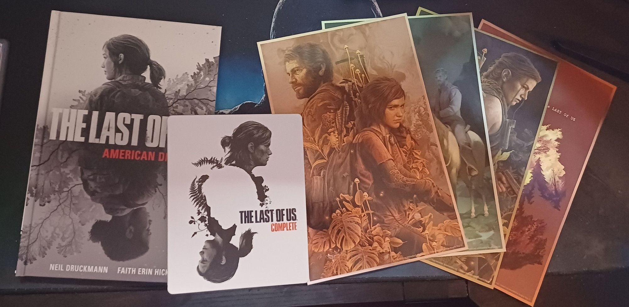 The Last of Us Complete Collector's Edition contents: steelbook, hardcover copy of American Dreams, and art prints