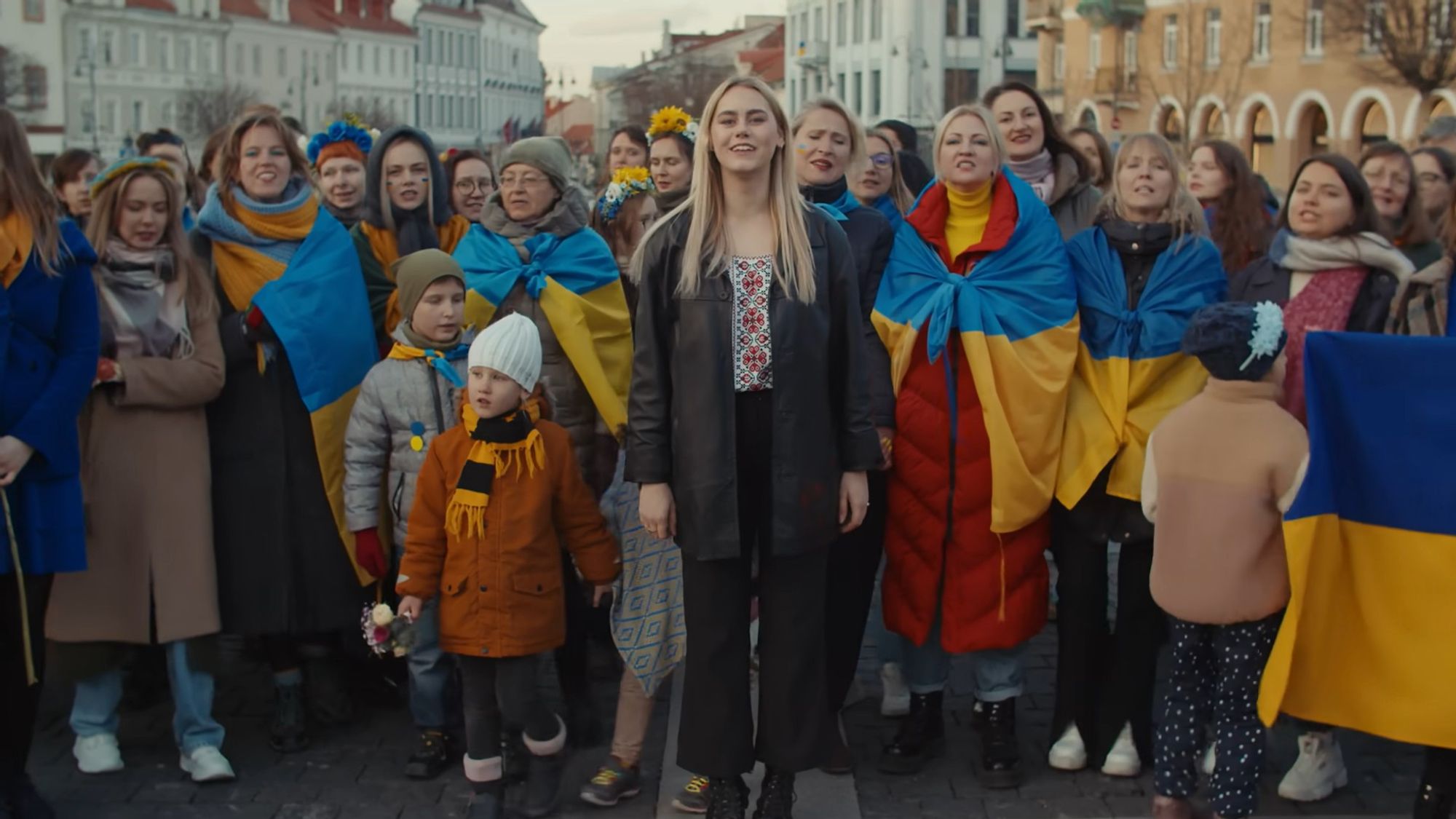 2022 - Ukrainian refugee Elizaveta sings together with 300 Lithuanians, who answered her call to gather in Vilnius and sing this viral Ukrainian folk song to draw attention to the ongoing war and struggles of Ukrainian people. (   • Ukrainian Folk Song 🇺🇦 ARMY REMIX | A...  0) This is a call to #standupforUkraine.
 Eliza is a 21 year old Ukrainian singer. She had to flee her home country when Russia invaded Ukraine in 2014 and has been living and studying in Lithuania since 2015. When Russia started the war on February 24th, her family’s home was destroyed by Russian occupants for the second time in their life. Eliza’s mother and brother stayed in Ukraine to defend their homeland. Eliza is safe in Lithuania, sending the message for her family and for her country to stay strong.
Help people like Eliza to rebuild their homes in Ukraine.