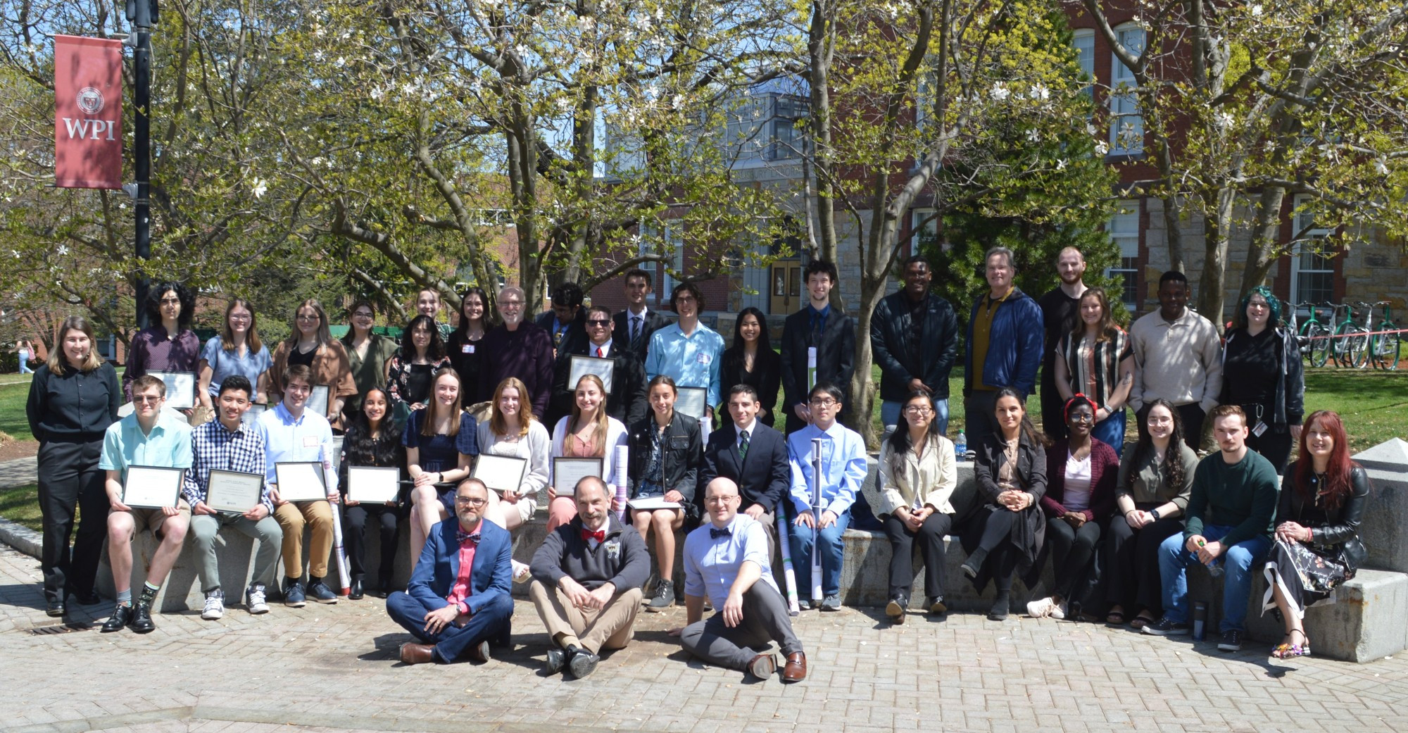 Members of WPI Chemistry & Biochemistry in a group photo in the middle of campus