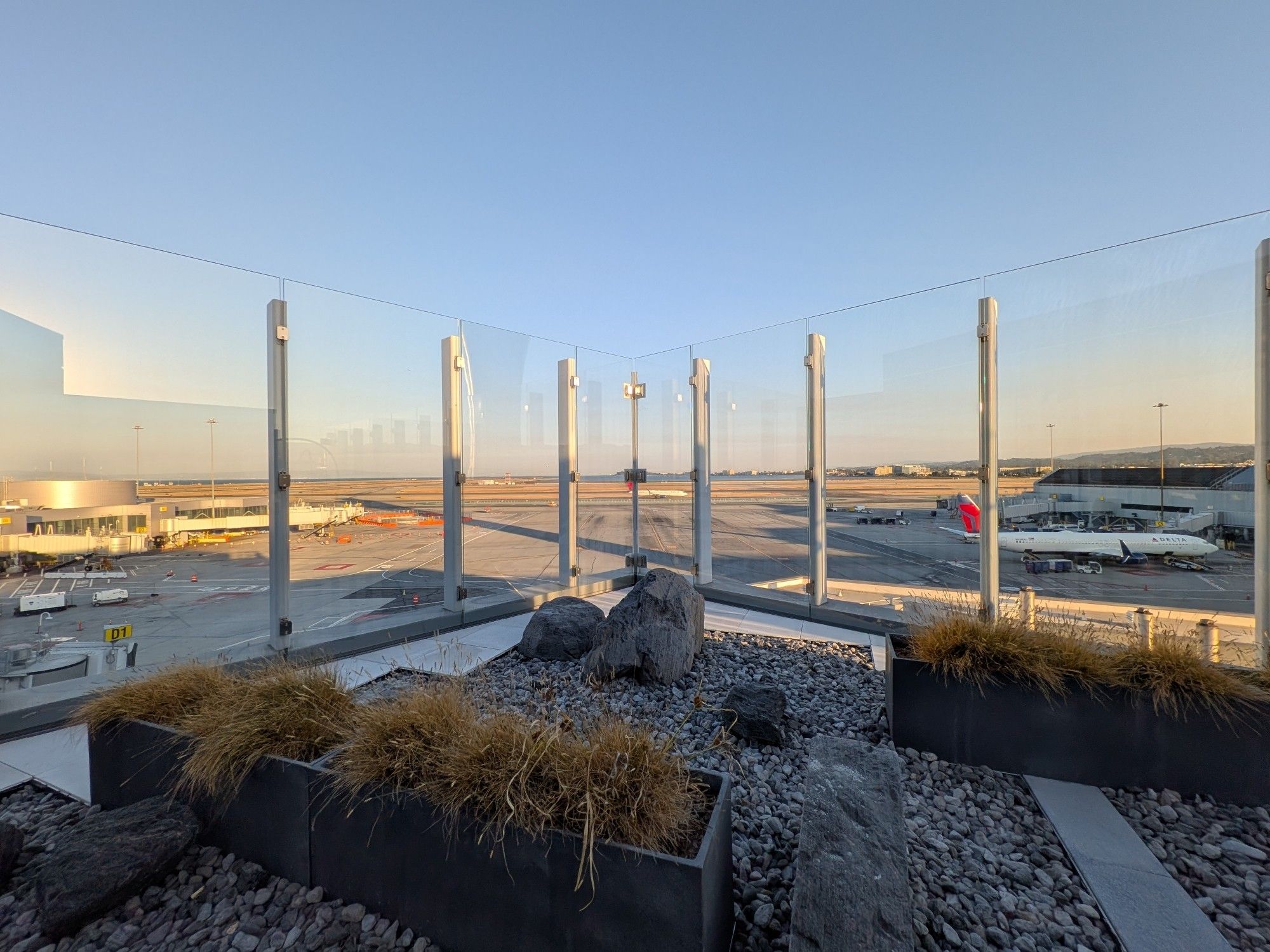 Sunset from an outdoor balcony overlooking SFO runways