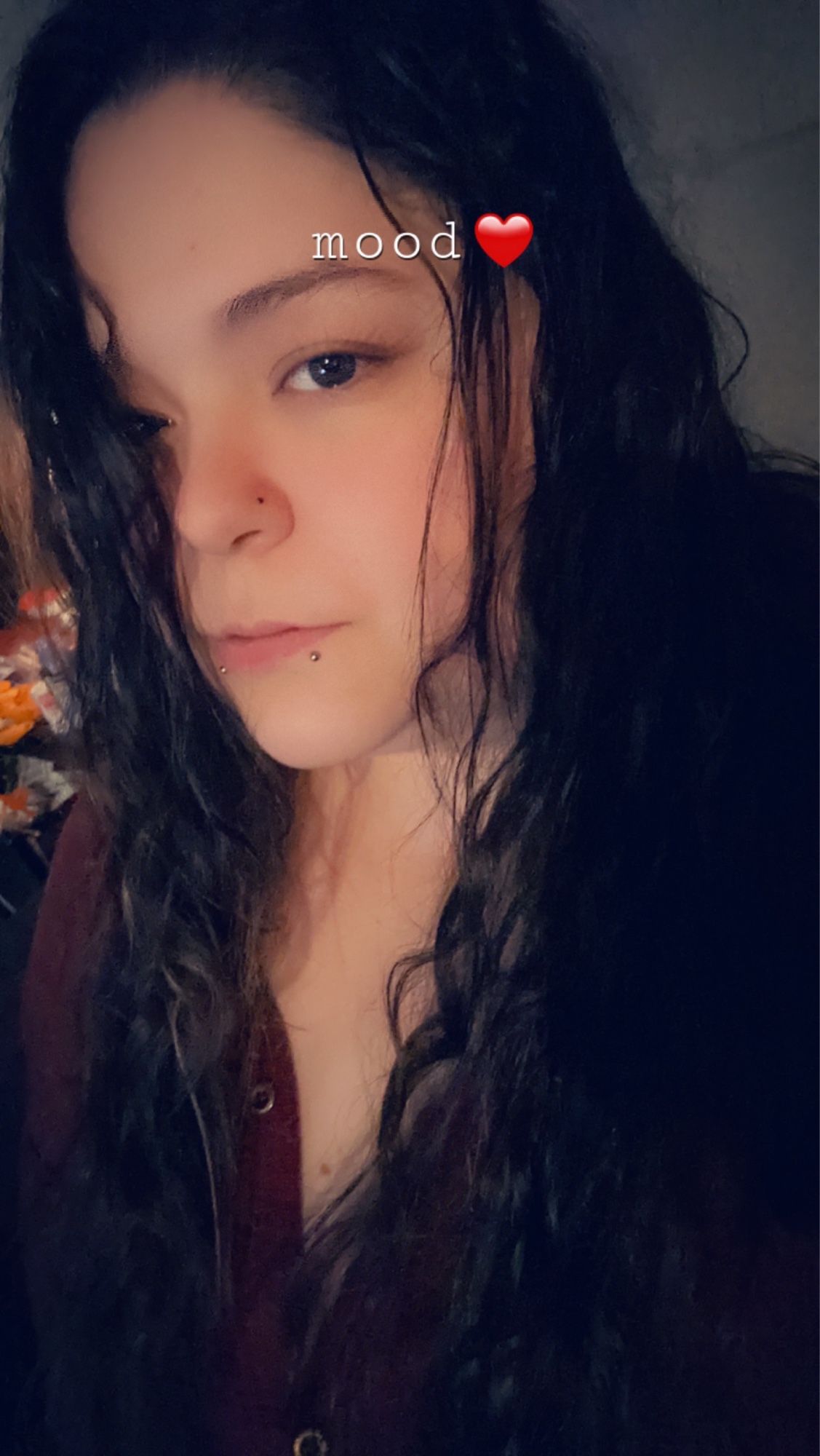 Bbw Domme with hair over one eye and "mood🖤" captioned over it