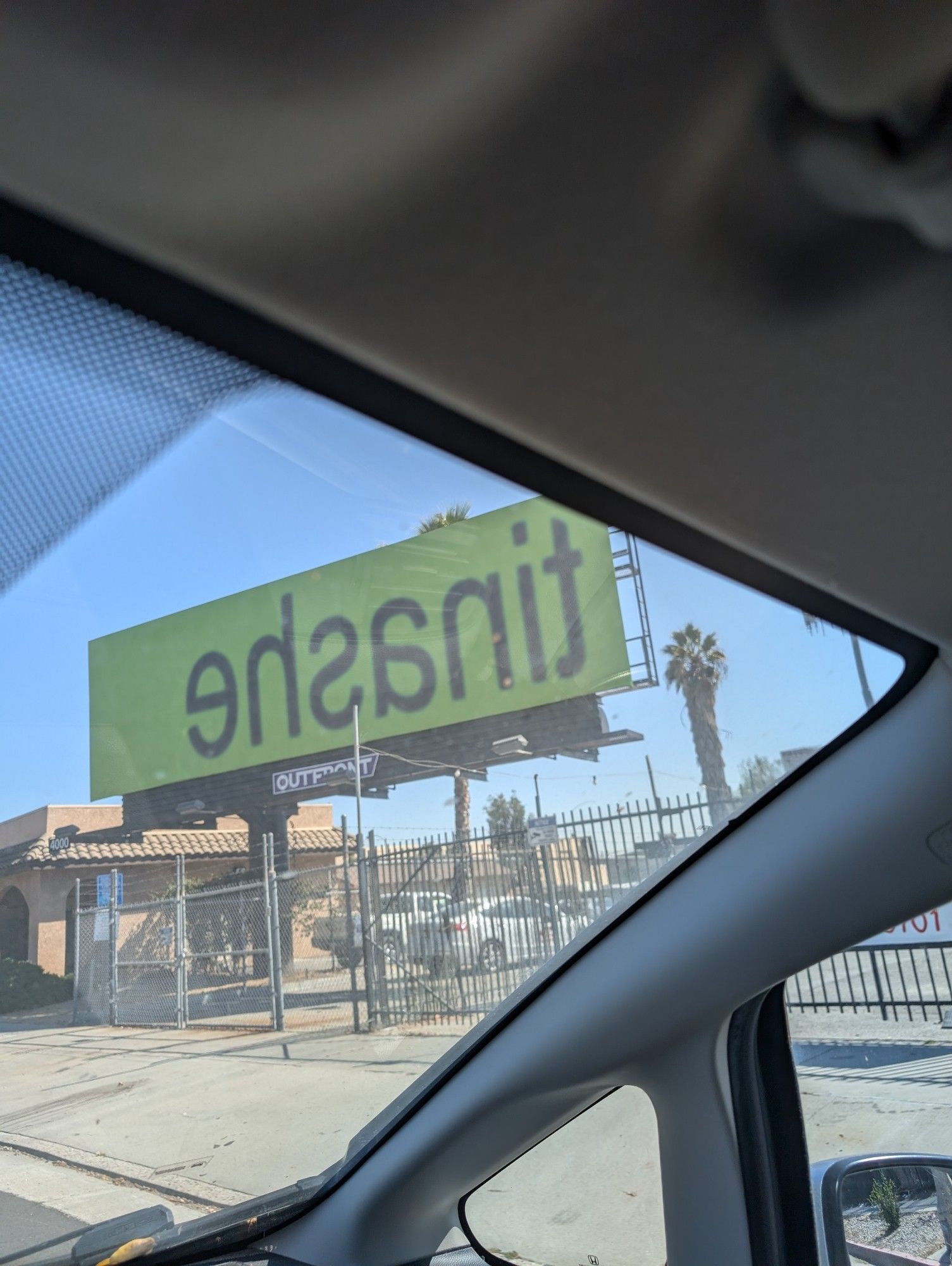 a billboard in Pasadena that says, in backwards brat font on brat green background, "tinashe"