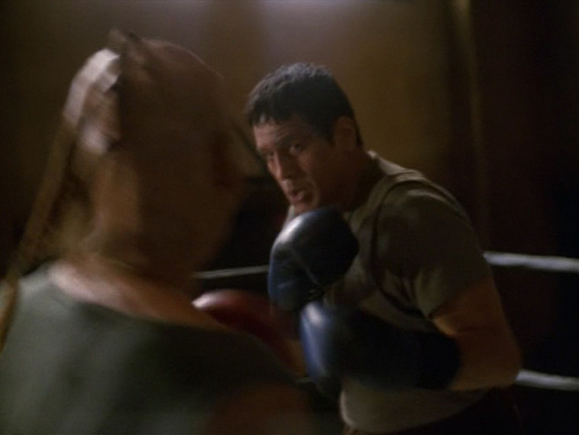 Picture of Chakotay in boxing ring fighting against an alien