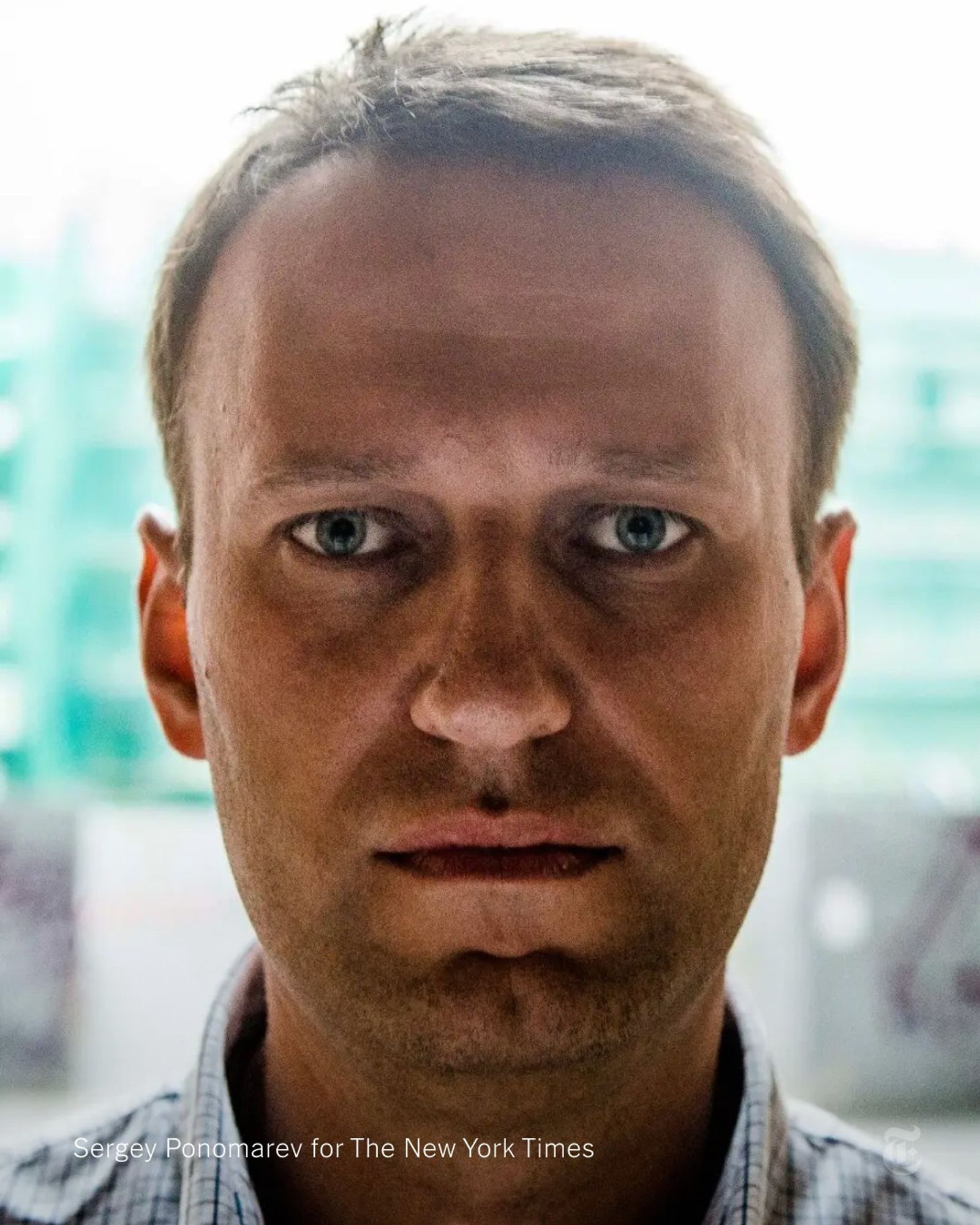 A close-up of Alexei Navalny posing for a portrait in Moscow in 2013. Photo by Sergey Ponomarev for The New York Times.