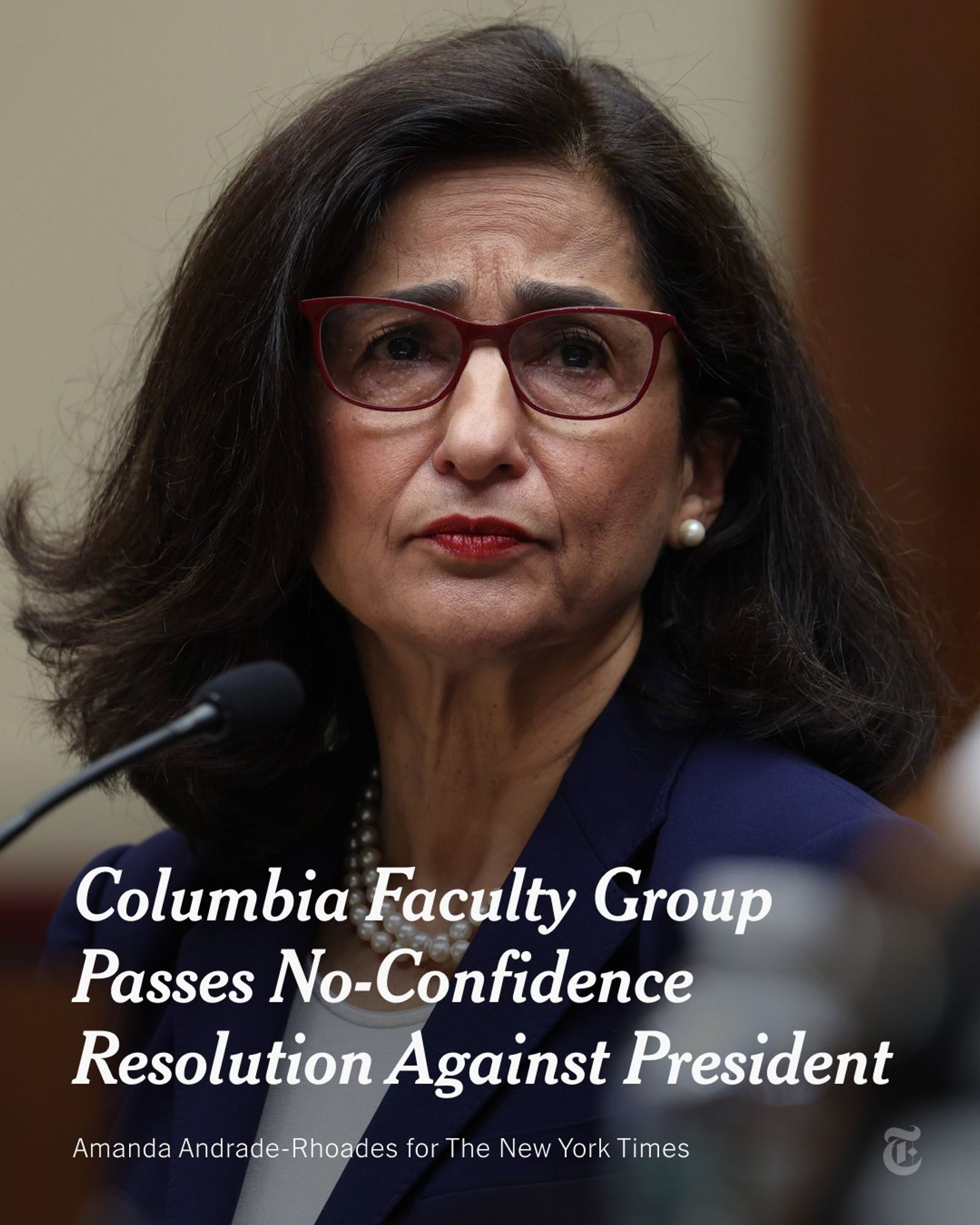 Columbia’s president, Nemat Shafik, is sitting in front of a microphone at a congressional committee hearing in April. She is wearing a blue blazer. A headline reads: "Columbia Faculty Group Passes No-Confidence Resolution Against President." Photo credit: Amanda Andrade-Rhoades for The New York Times.