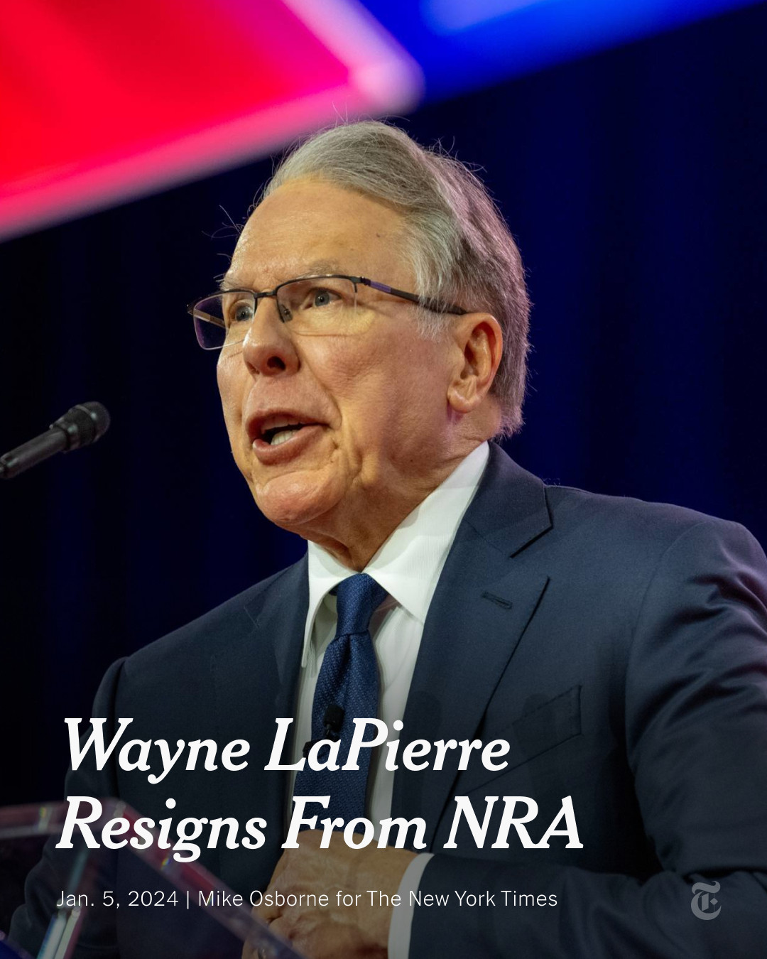 Wayne LaPierre, the former CEO of the National Rifle Association, is seen speaking on the main stage at CPAC in 2023. A headline reads: "Wayne LaPierre Resigns From NRA." Photo by Mike Osborne for The New York Times.