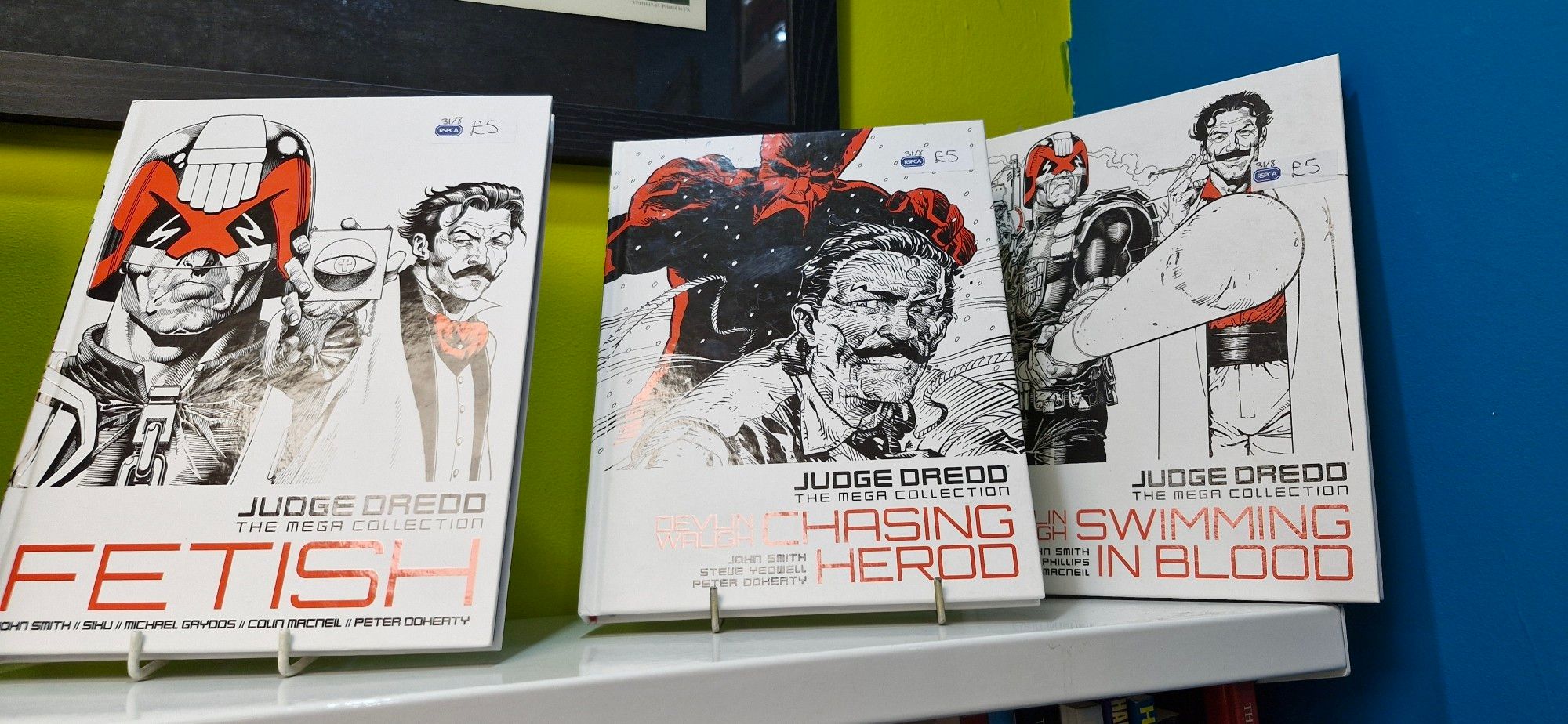 Three Judge Dredd graphic novels - Fetish, Chasing Herod and Swimming In Blood.