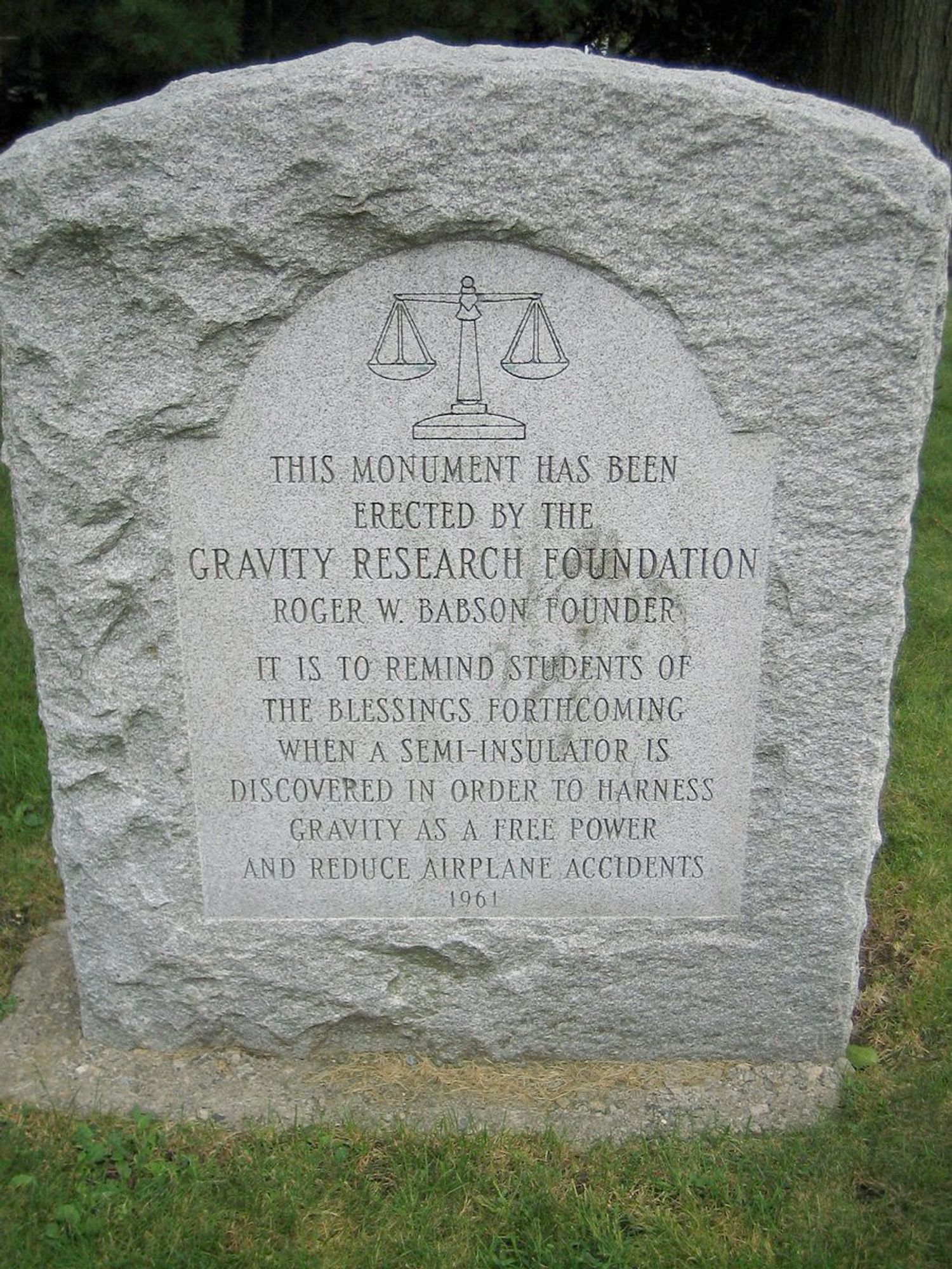 A monument erected by the gravity research foundation that reads that "It is to remind students of the blessings forthcoming when a semi-insulator is discovered in order to harness gravity as a free power an reduce airplane accidents.