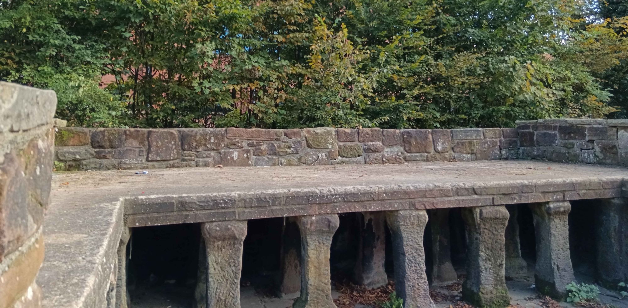 A set of pillars supporting a level floor.