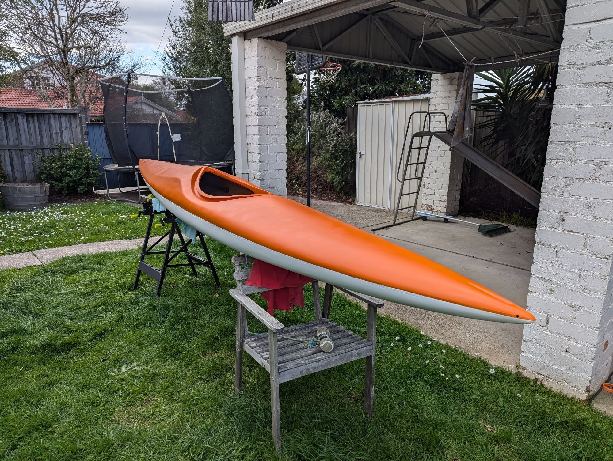 Bright orange and white two-tone kayak. Take my word for it: it looks fucking gorgeous.