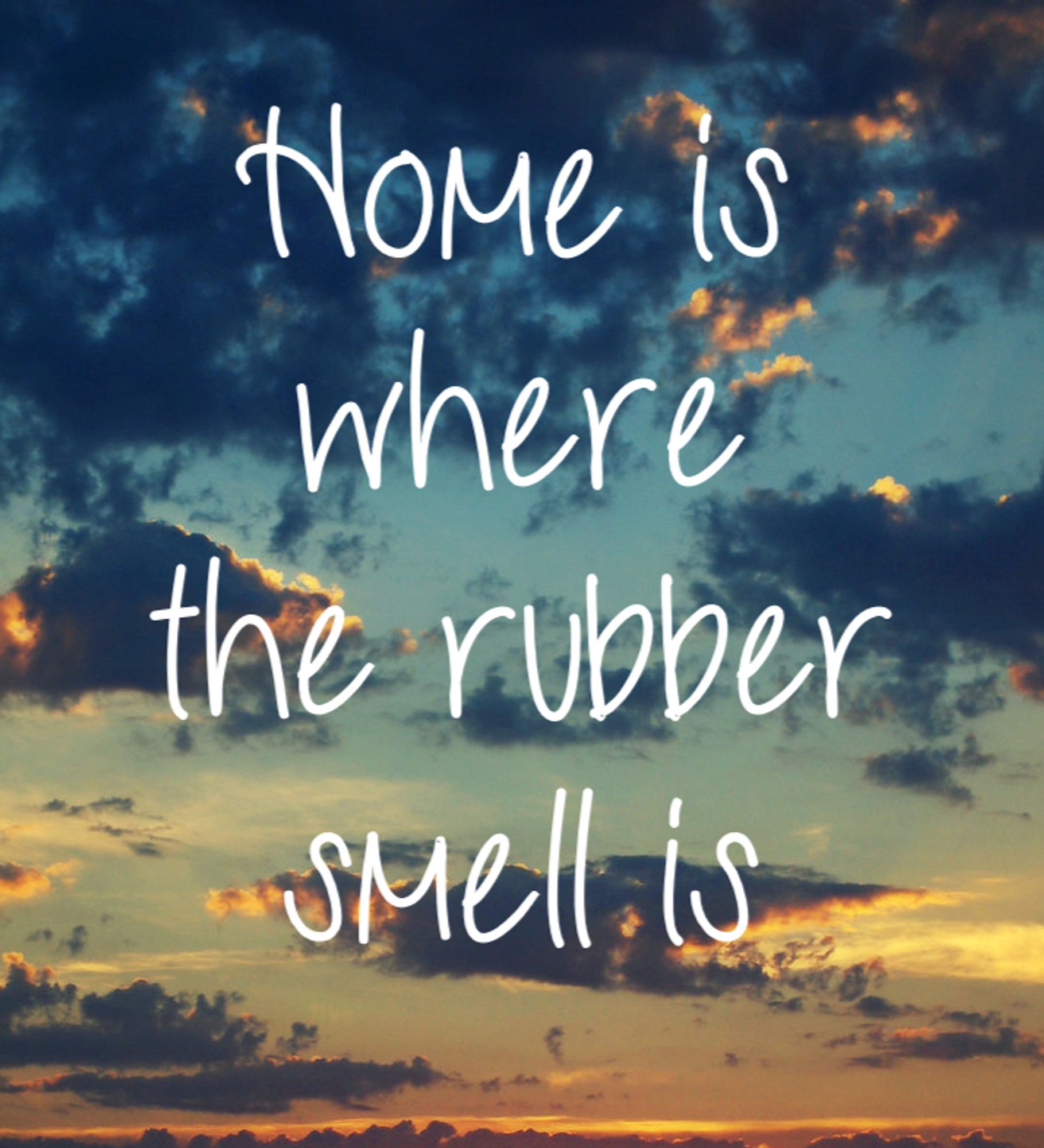 An intentionally generic sunset picture with "live laugh love"-styled text saying "Home is where the rubber smell is"