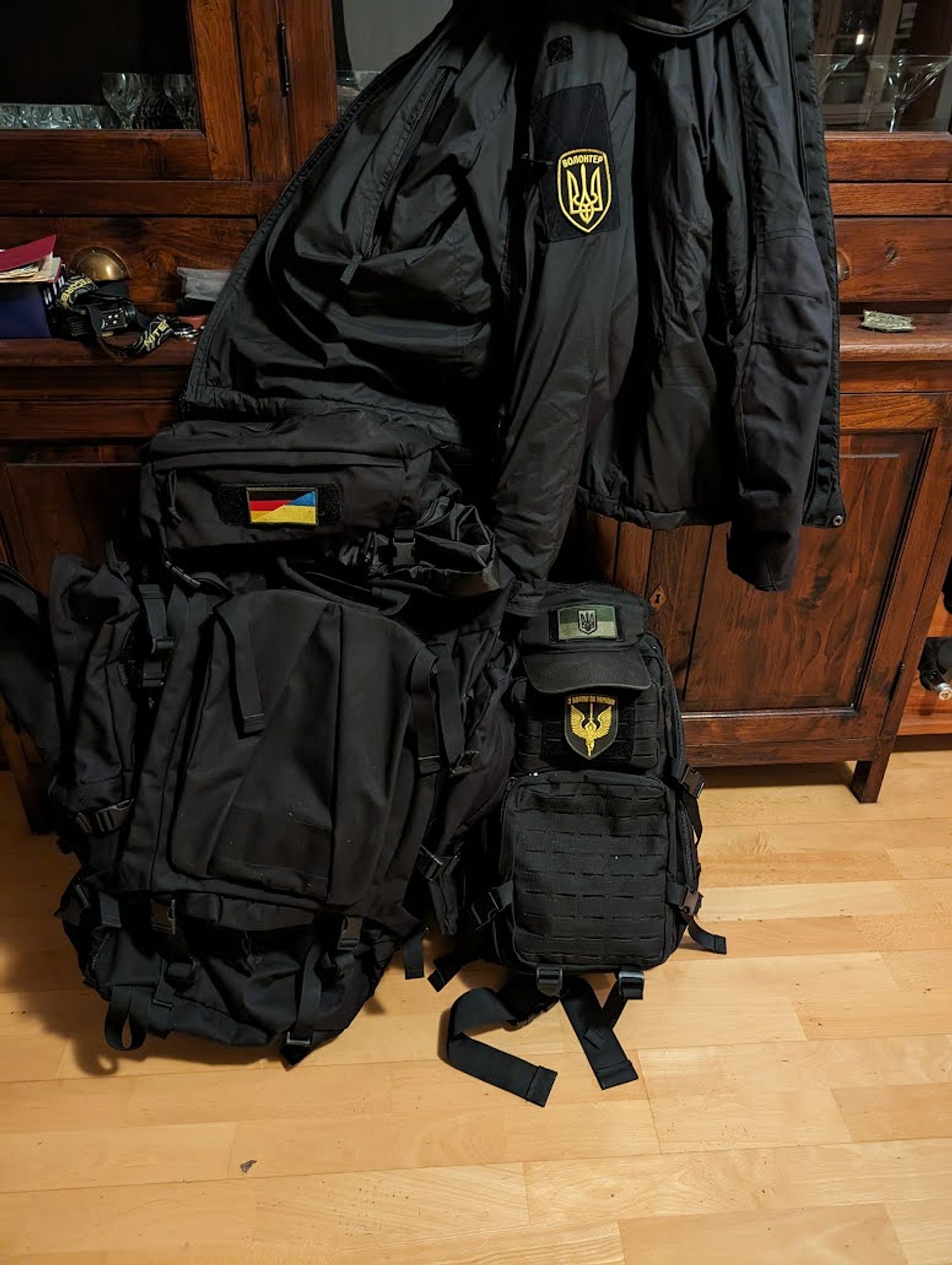 Tactical gear with Ukrainian/German morale patches.