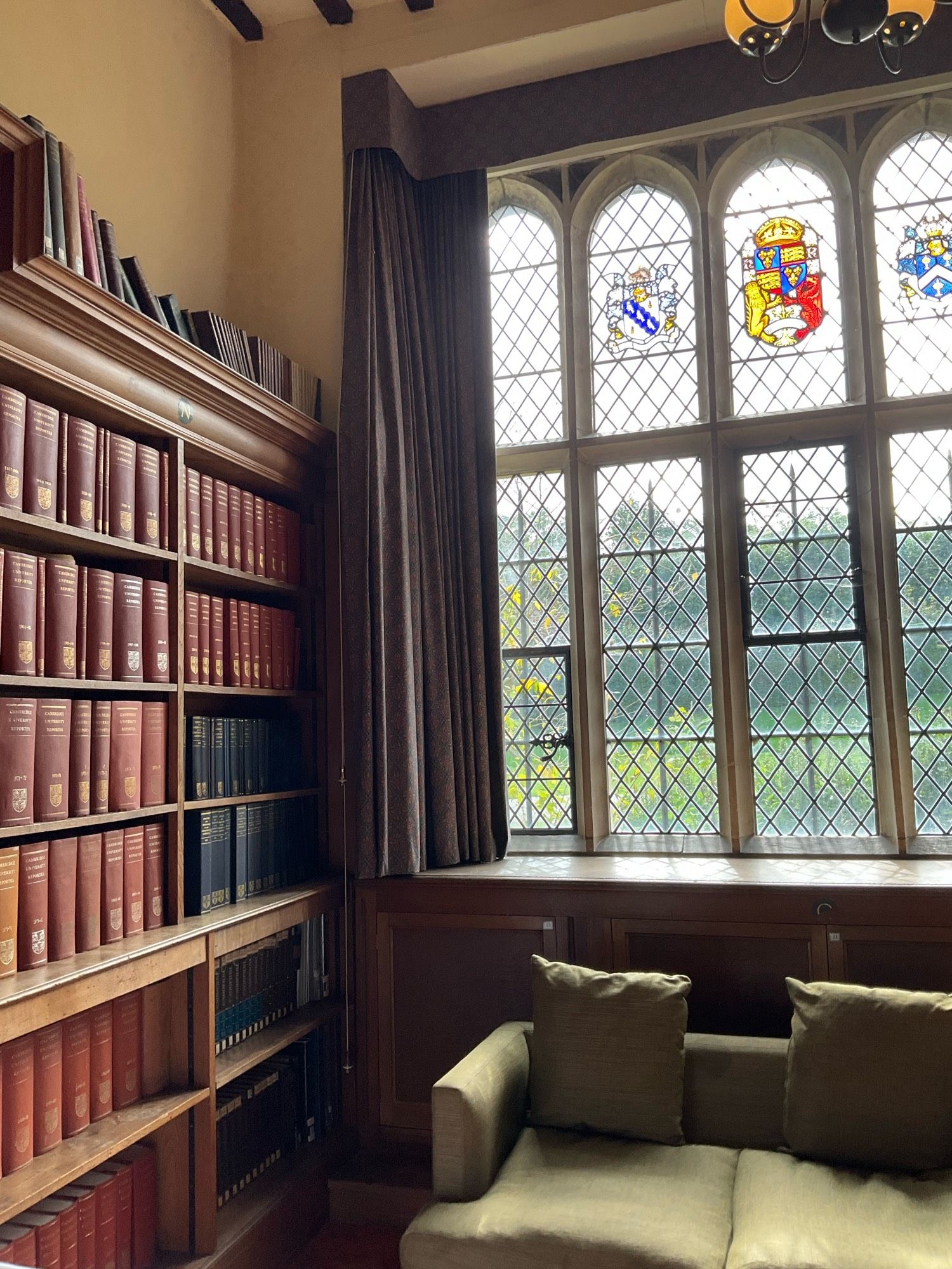 A diamond paned leaded window in the historic library at Madingley Hall in Cambridge