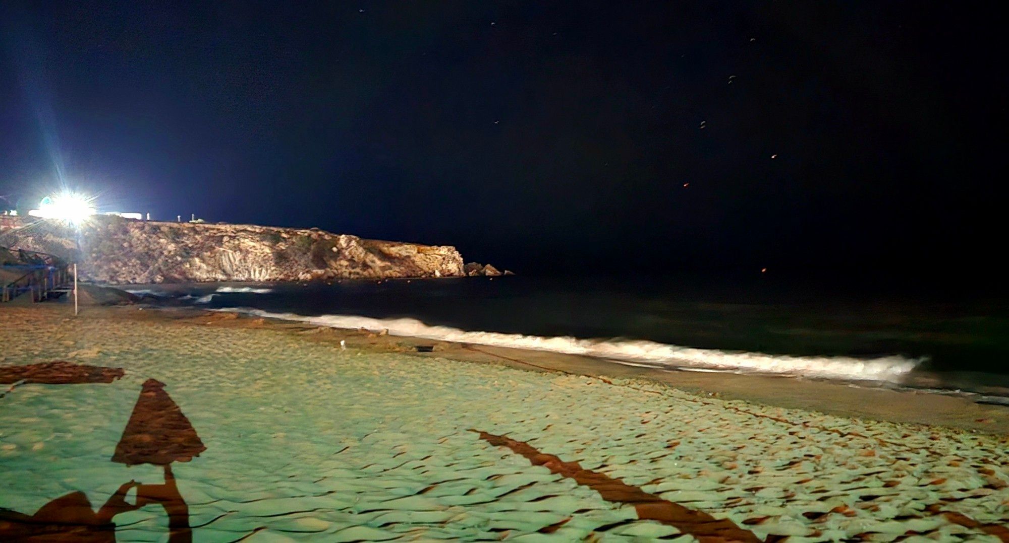 The beach outside my hotel. It's dark and there is almost no people.