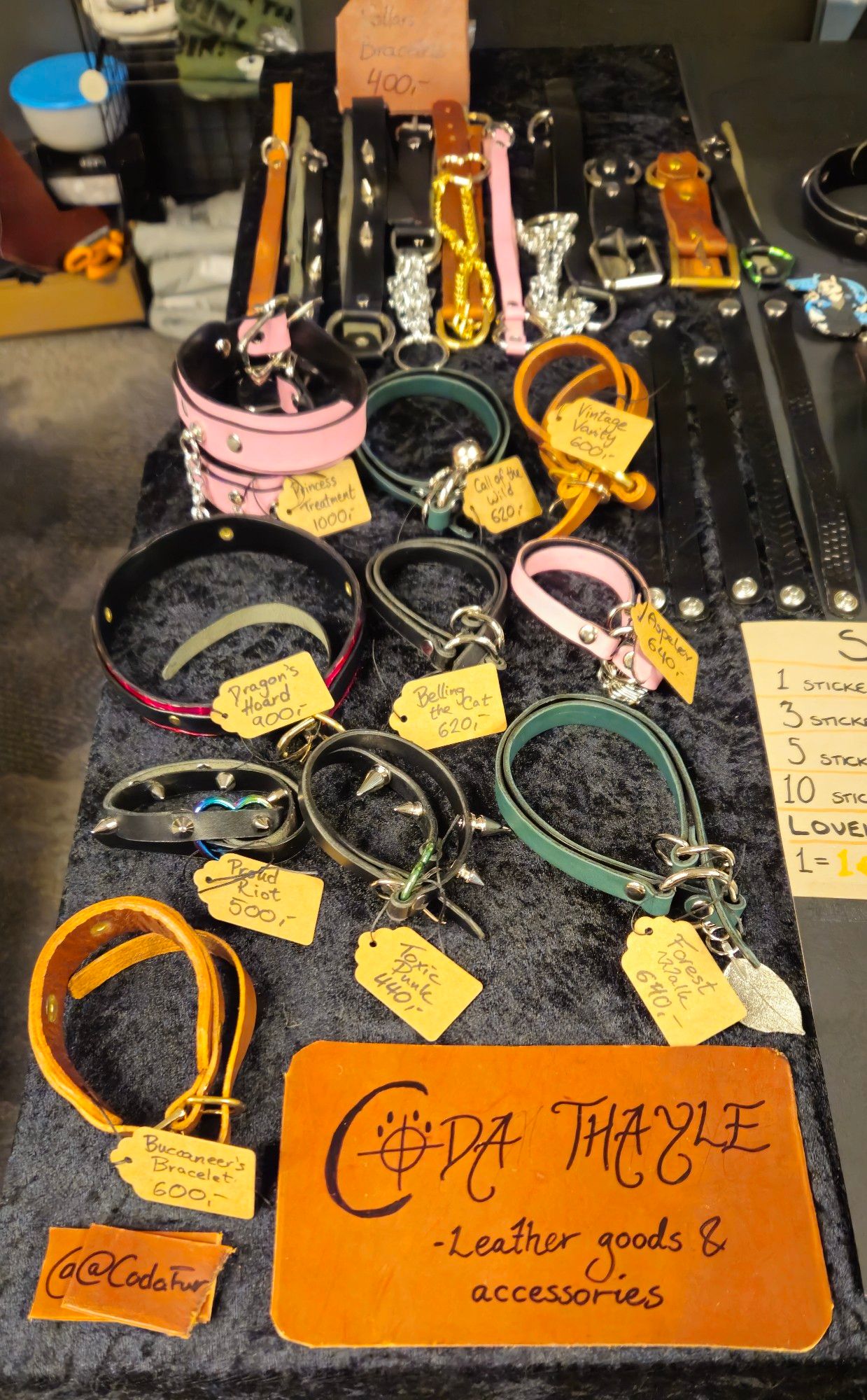 A Dealer's Den stand with leather goods