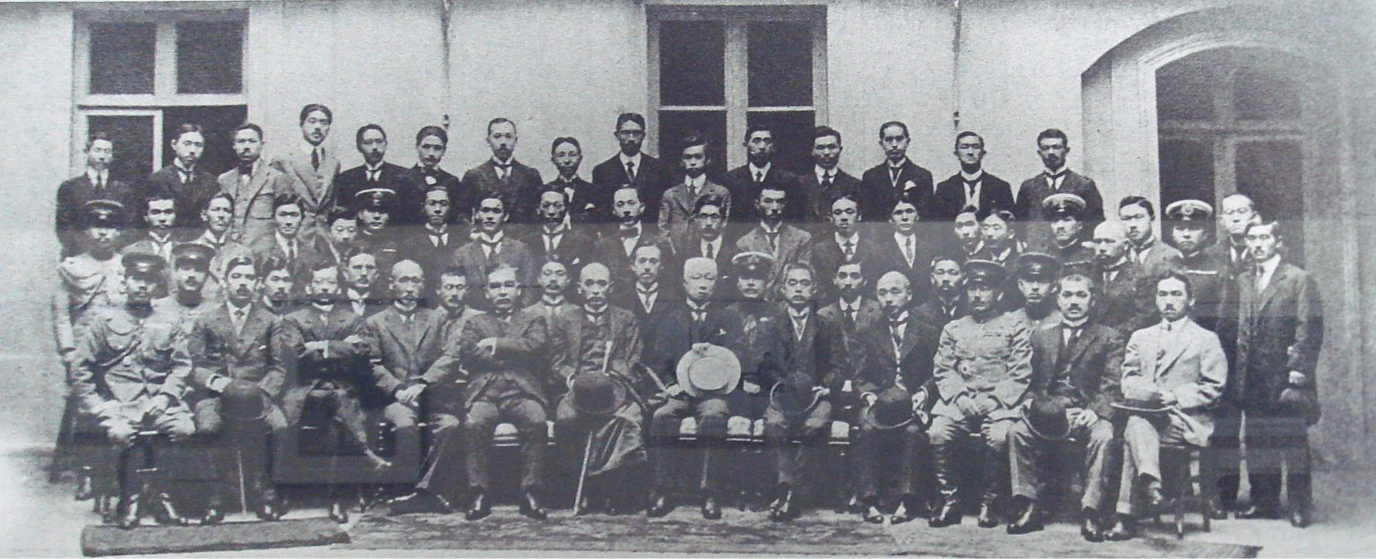 Three rows of Japanese diplomats at the Paris Peace Conference after WWI.