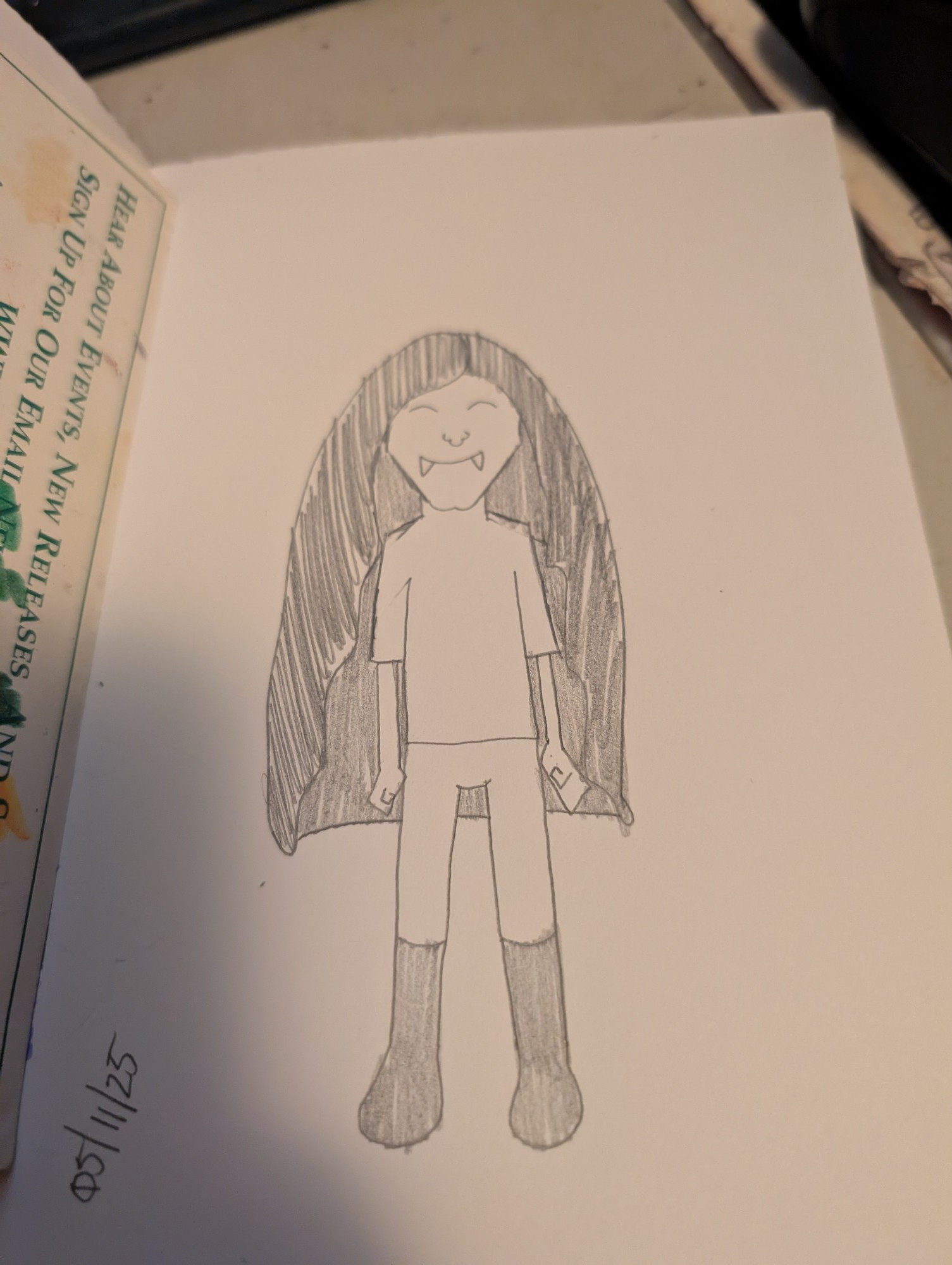 a sketchbook drawing of a vampire with long dark hair.