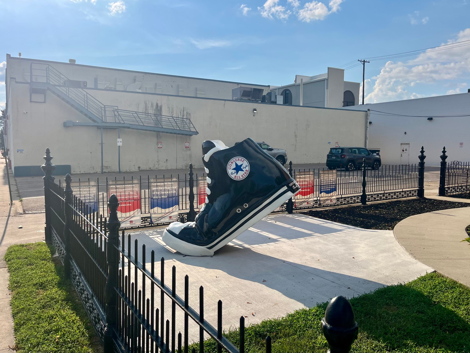 Sculpture of a black Chuck Taylor Allstar sneaker. 