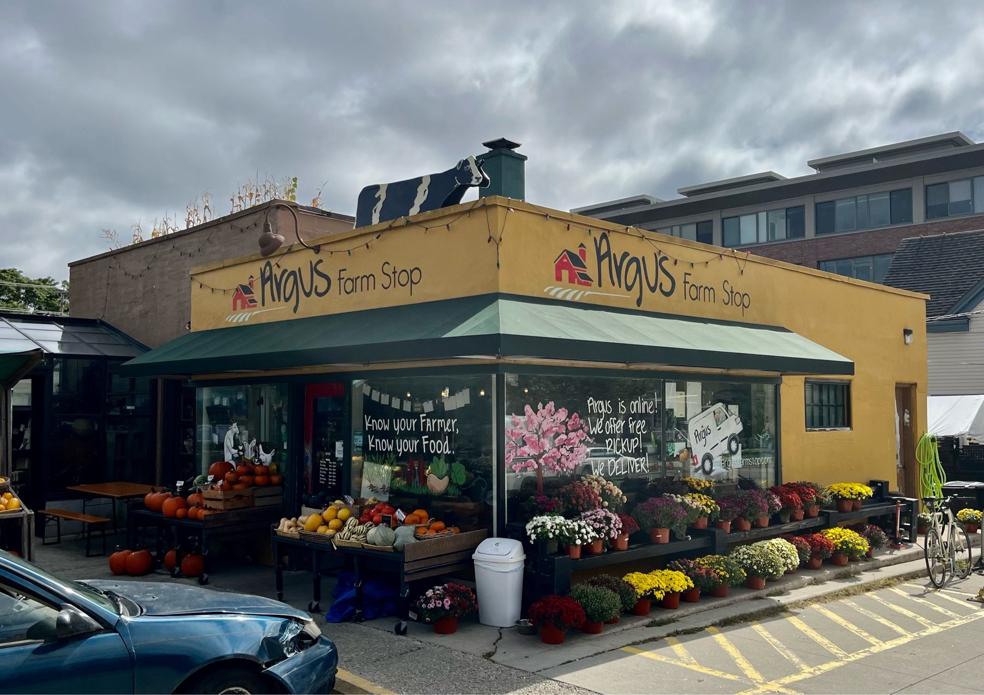 Small co-op called the Argus Farm Stop. All kinds of colorful produce and flowers are arranged along the outside of the building.