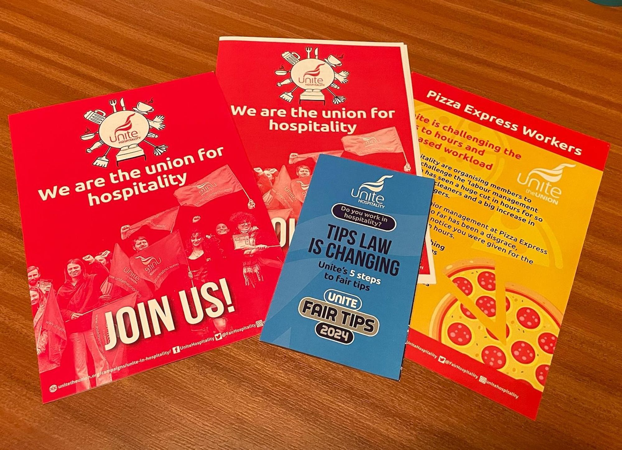 Several leaflets from the Unite Hospitality stall, including information about fair tips, workload, membership and workers' rights.